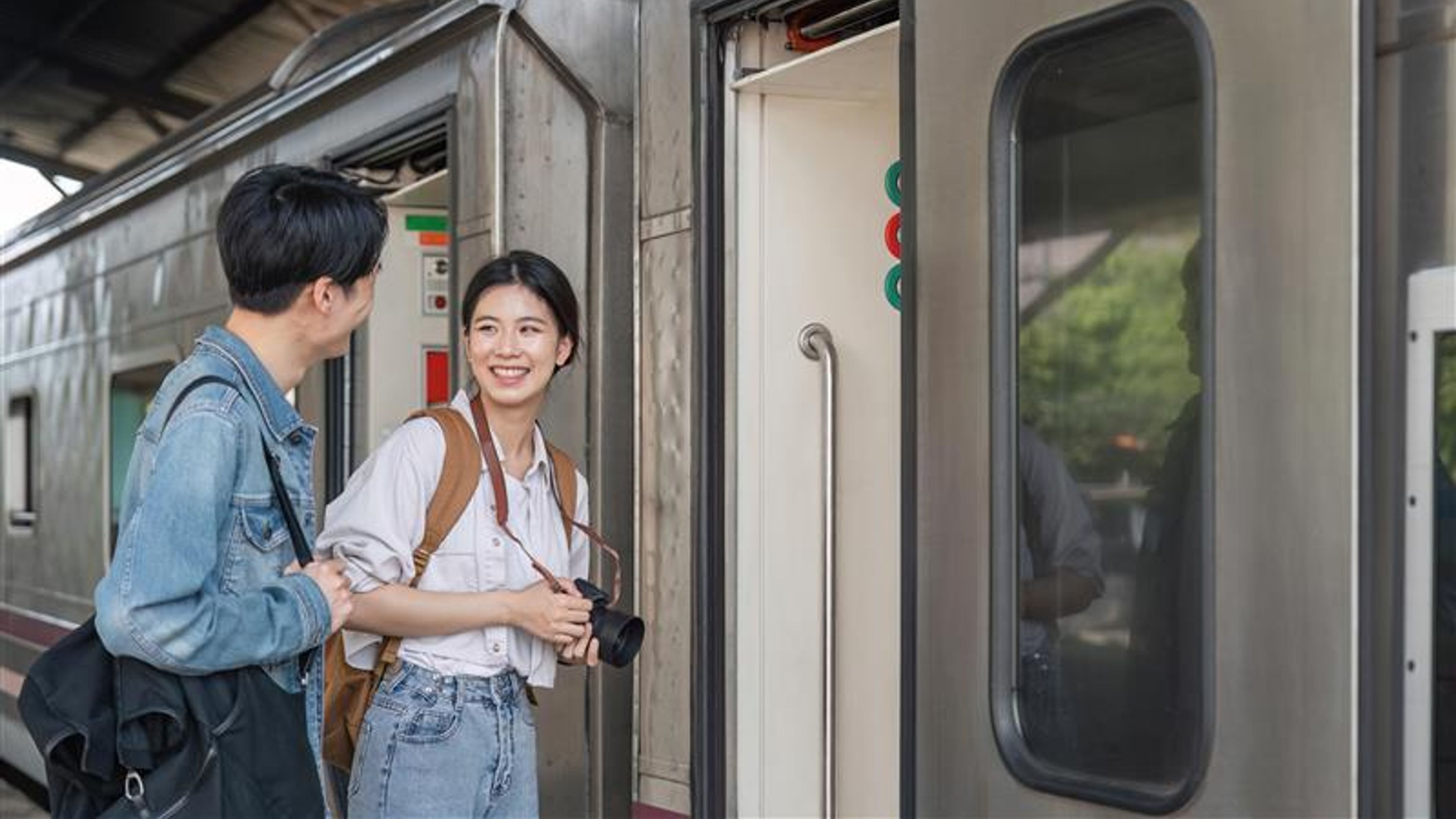 A couple getting into a train