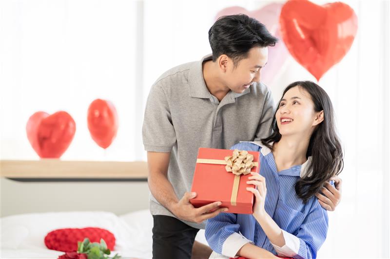 A happy couple sharing valentine’s day gift