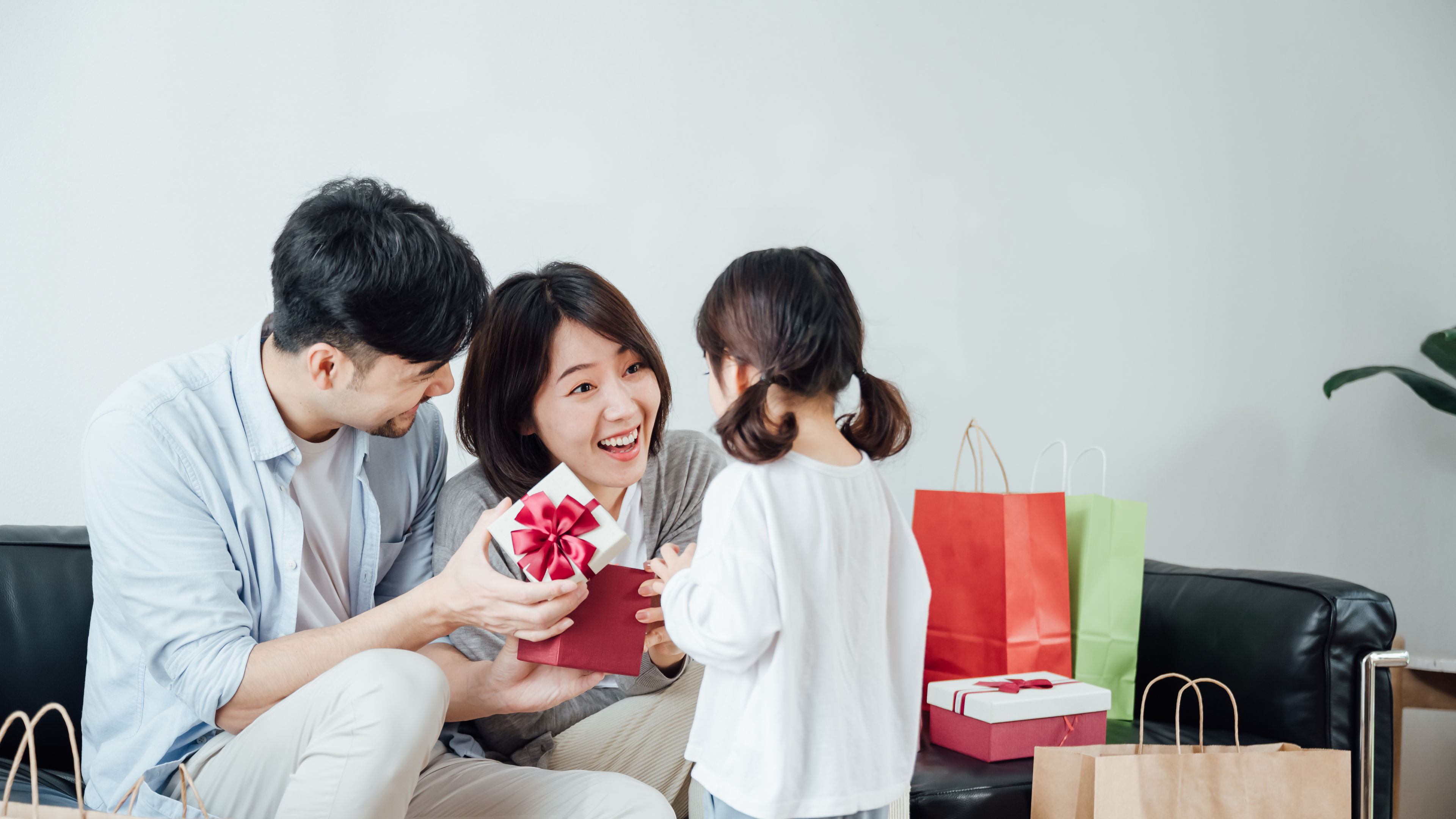 A family giving a gift to their child