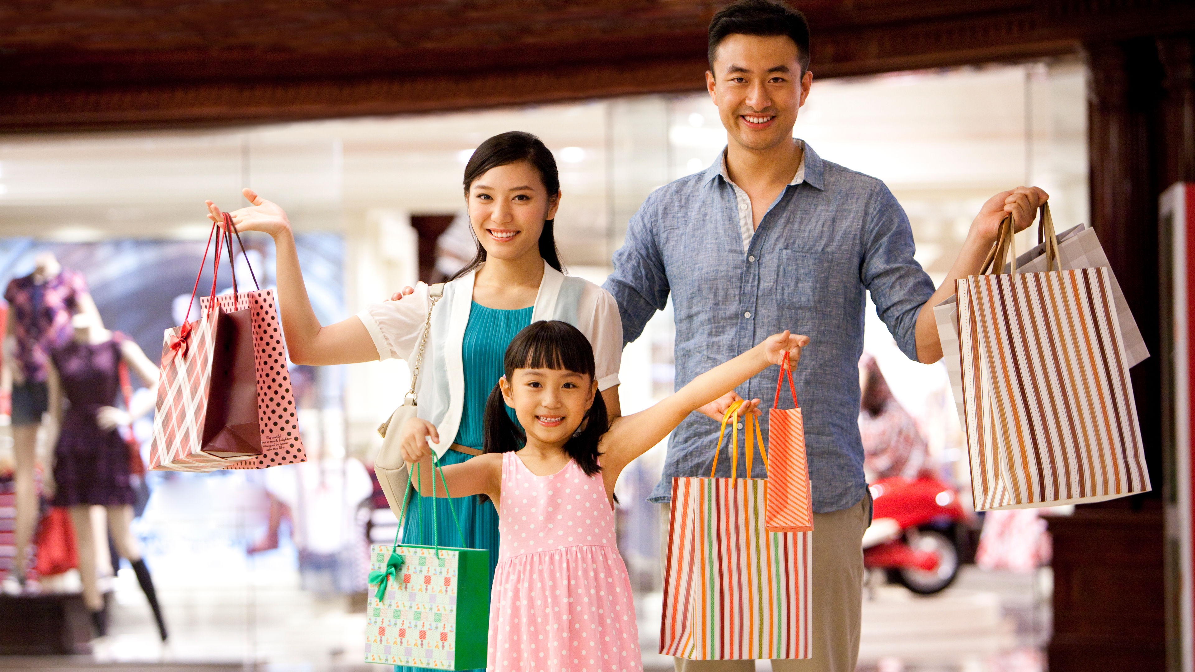 A family of four shopping in a department store 