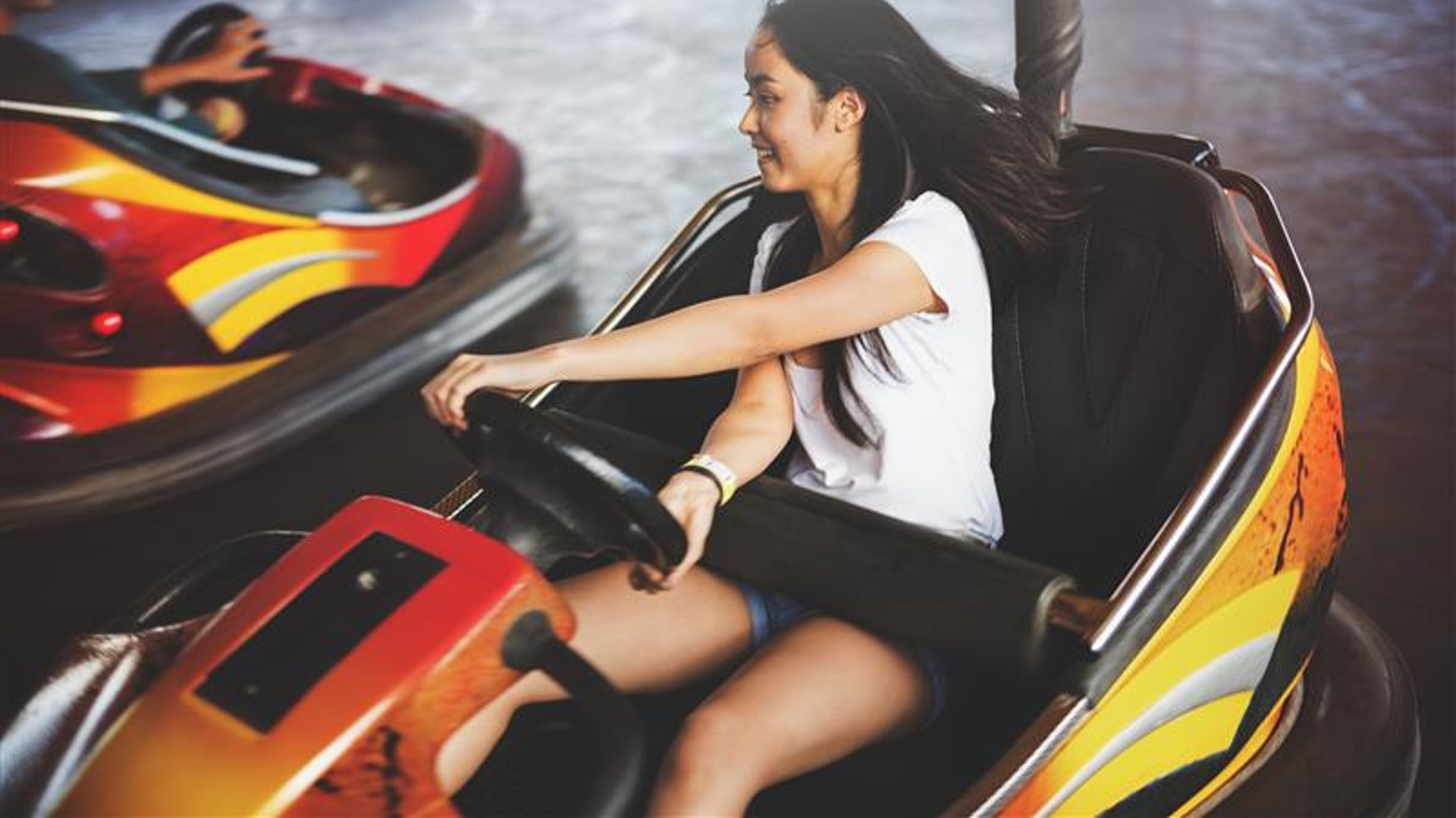 A girl driving a bumper car