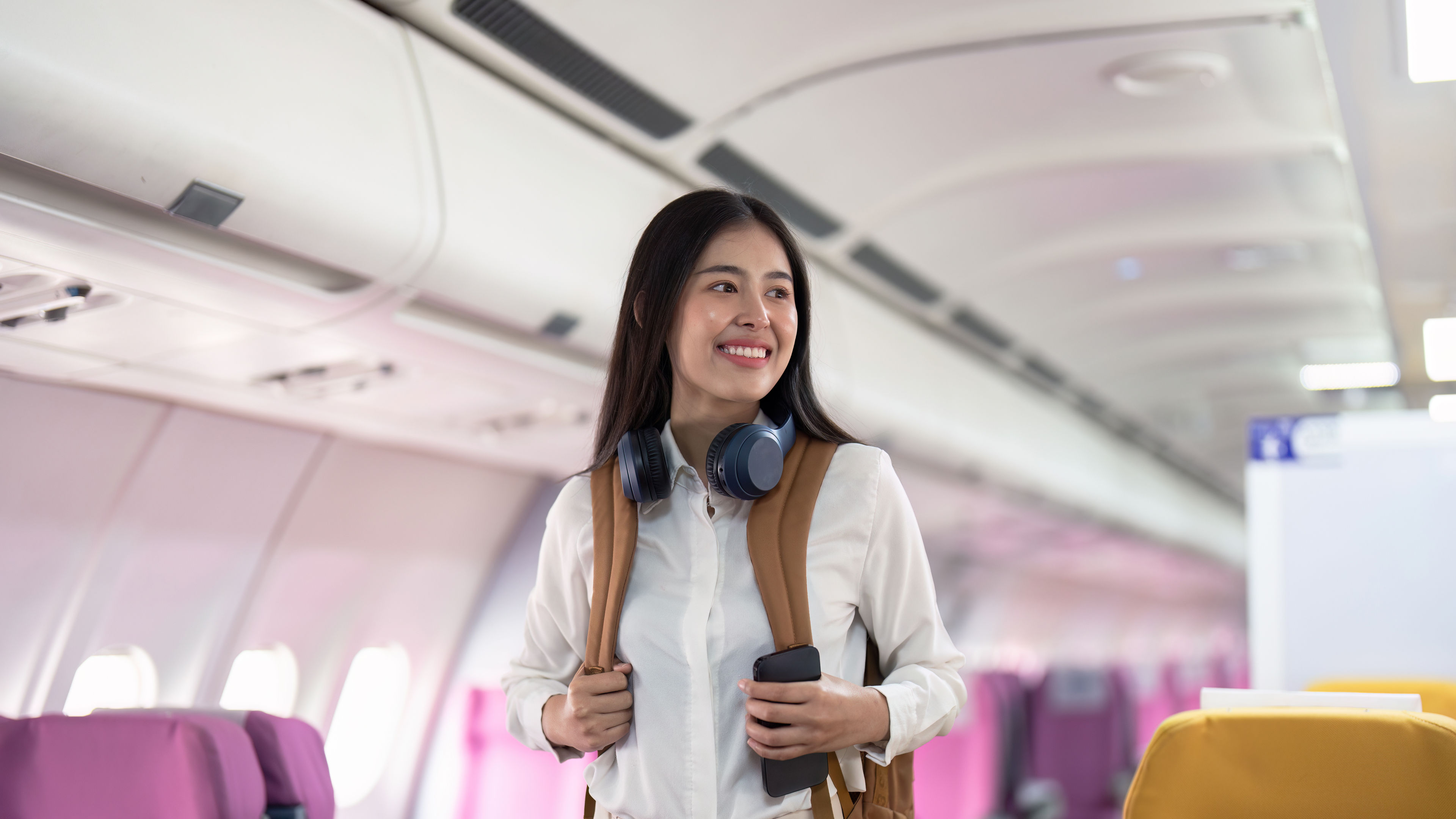 A happy woman passenger on flight