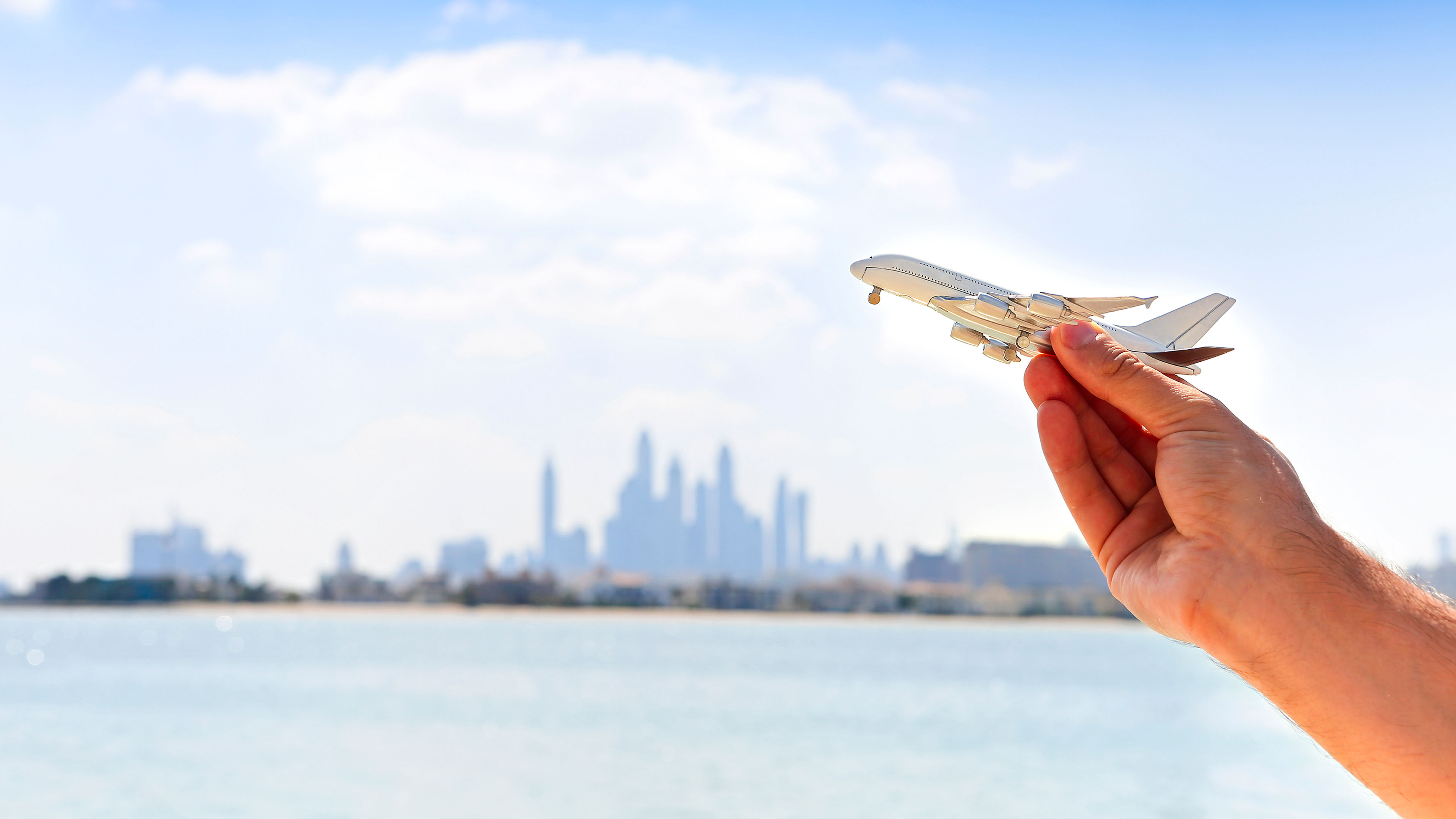 A man holding the miniature of flight