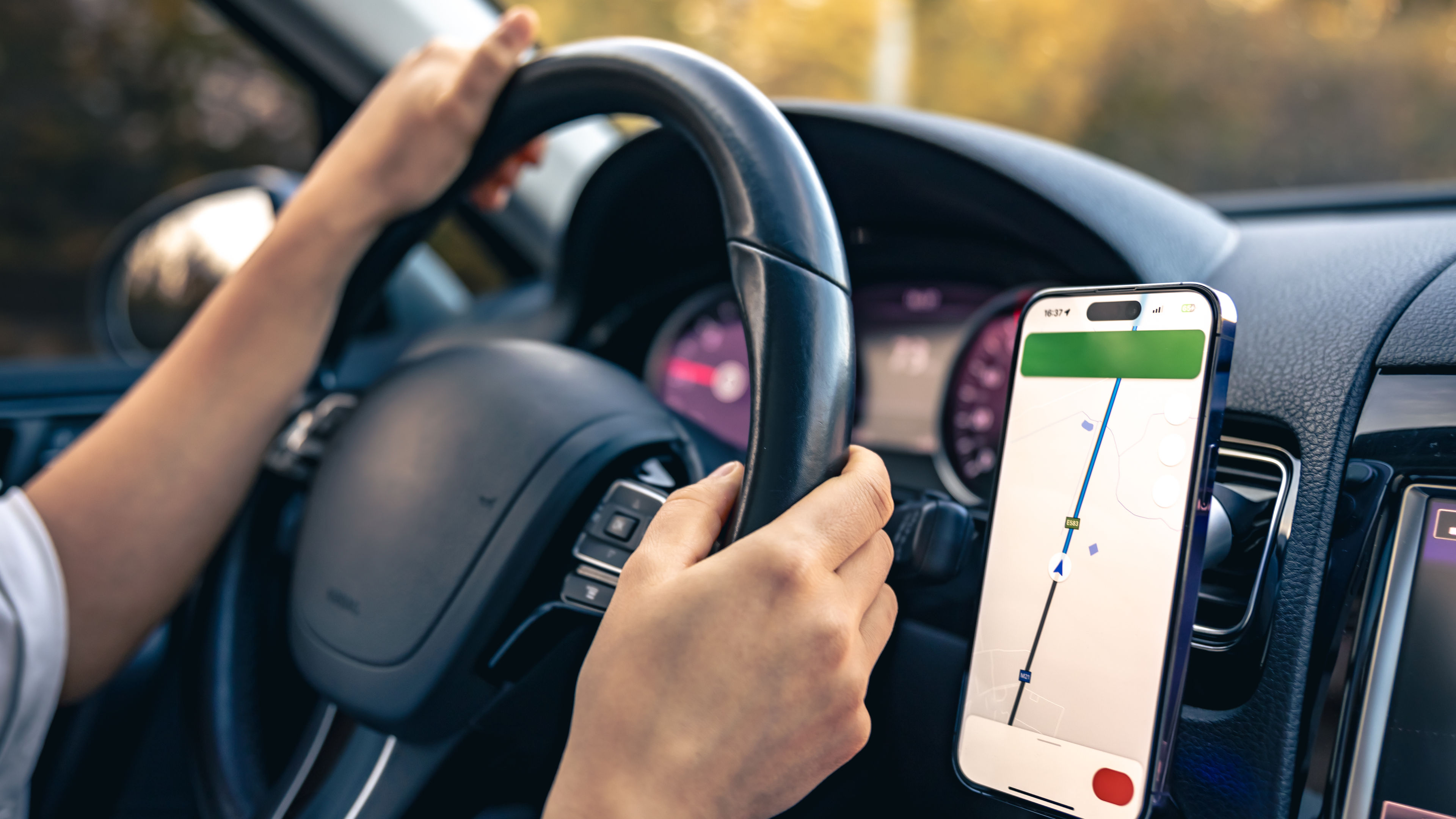 A person driving with a navigation app 