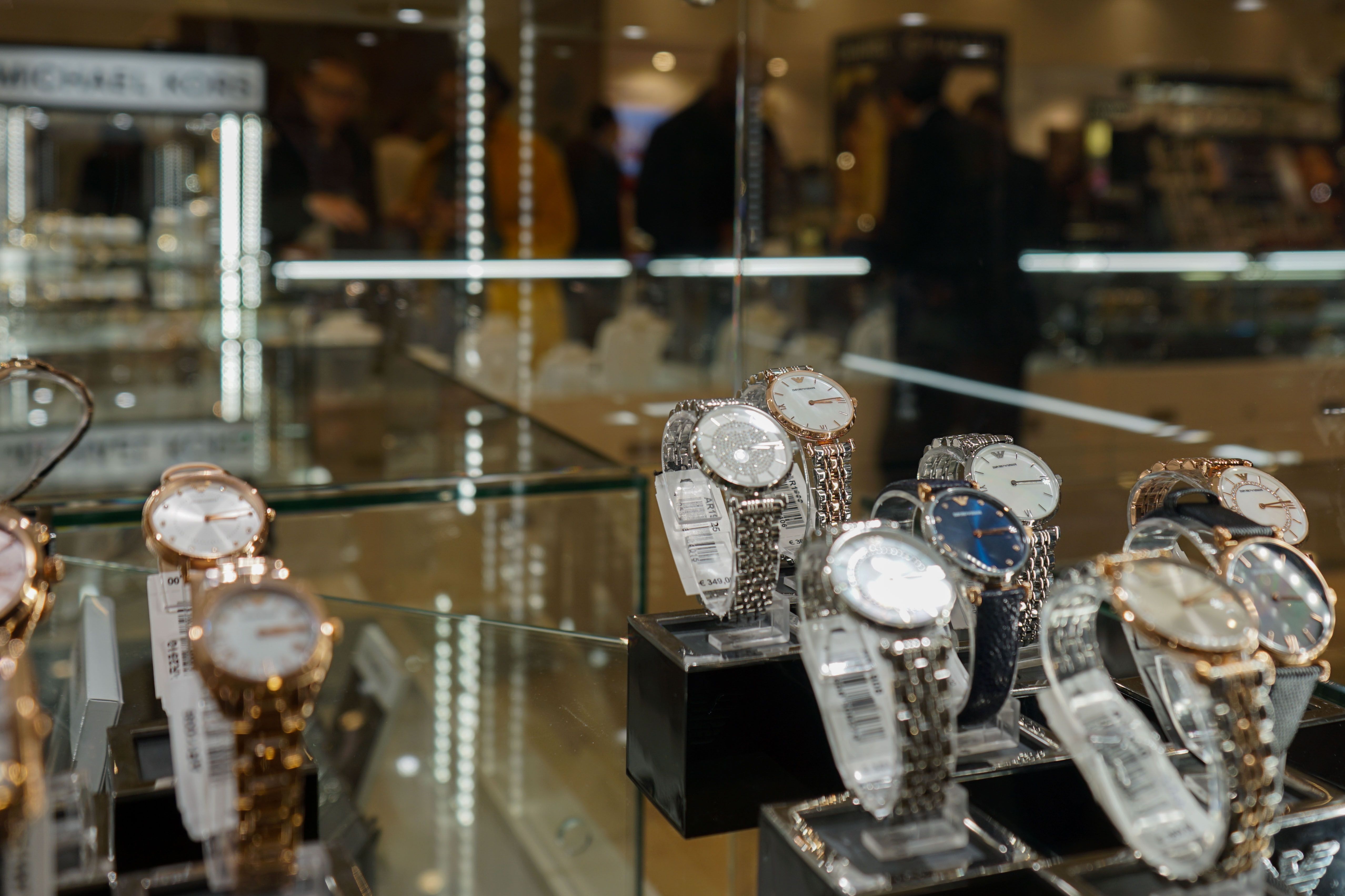 A glass case filled with a dazzling collection of timepieces 
