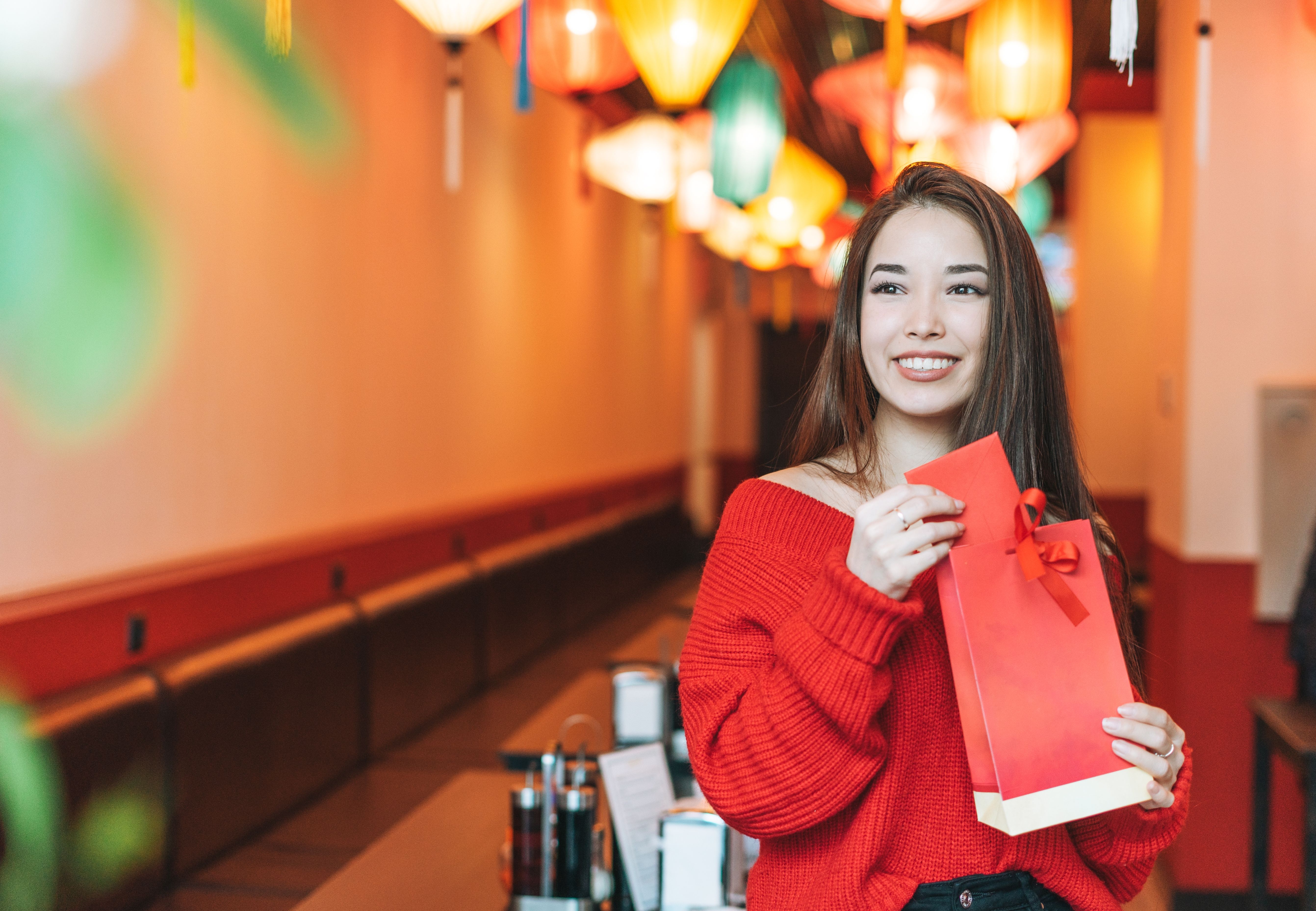 A happy woman holding a special gift 