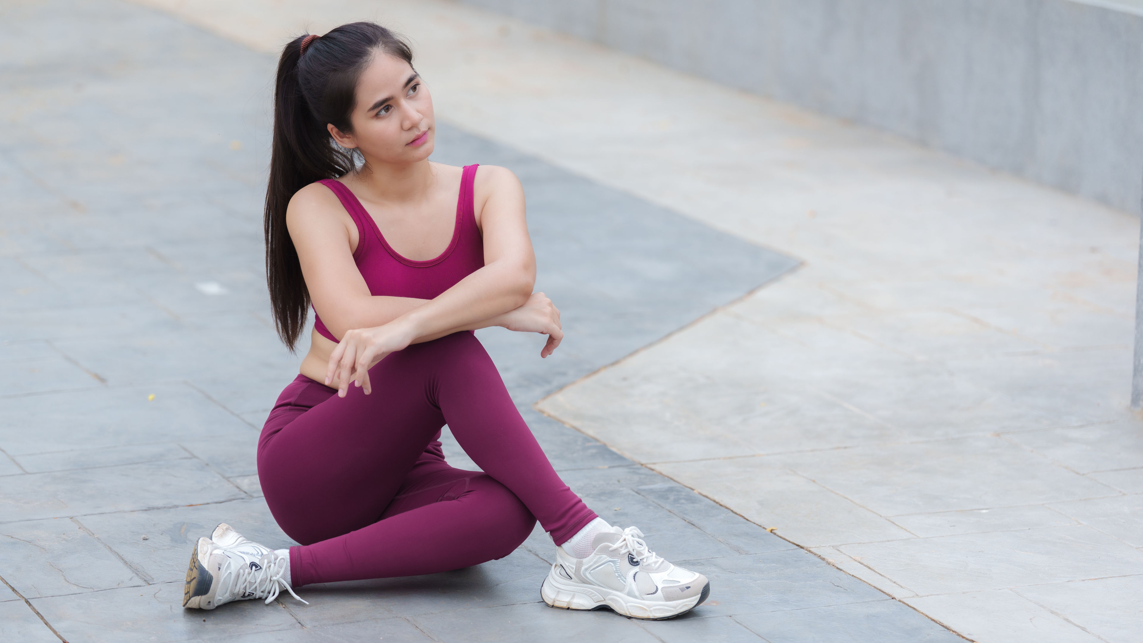 A woman is taking a rest after a workout
