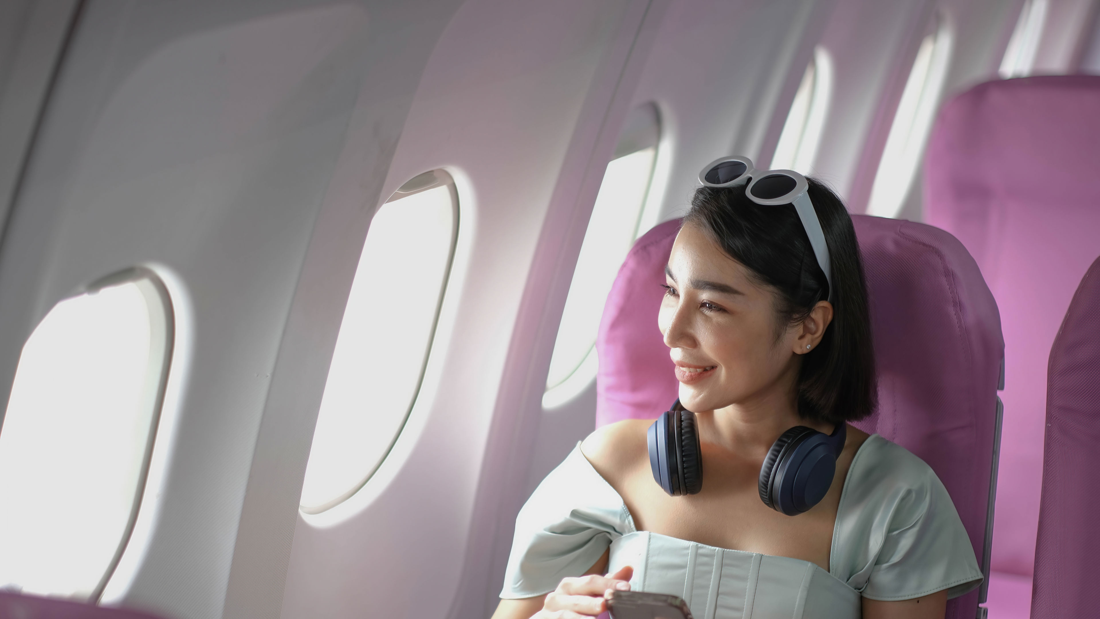 A woman travelling in a flight