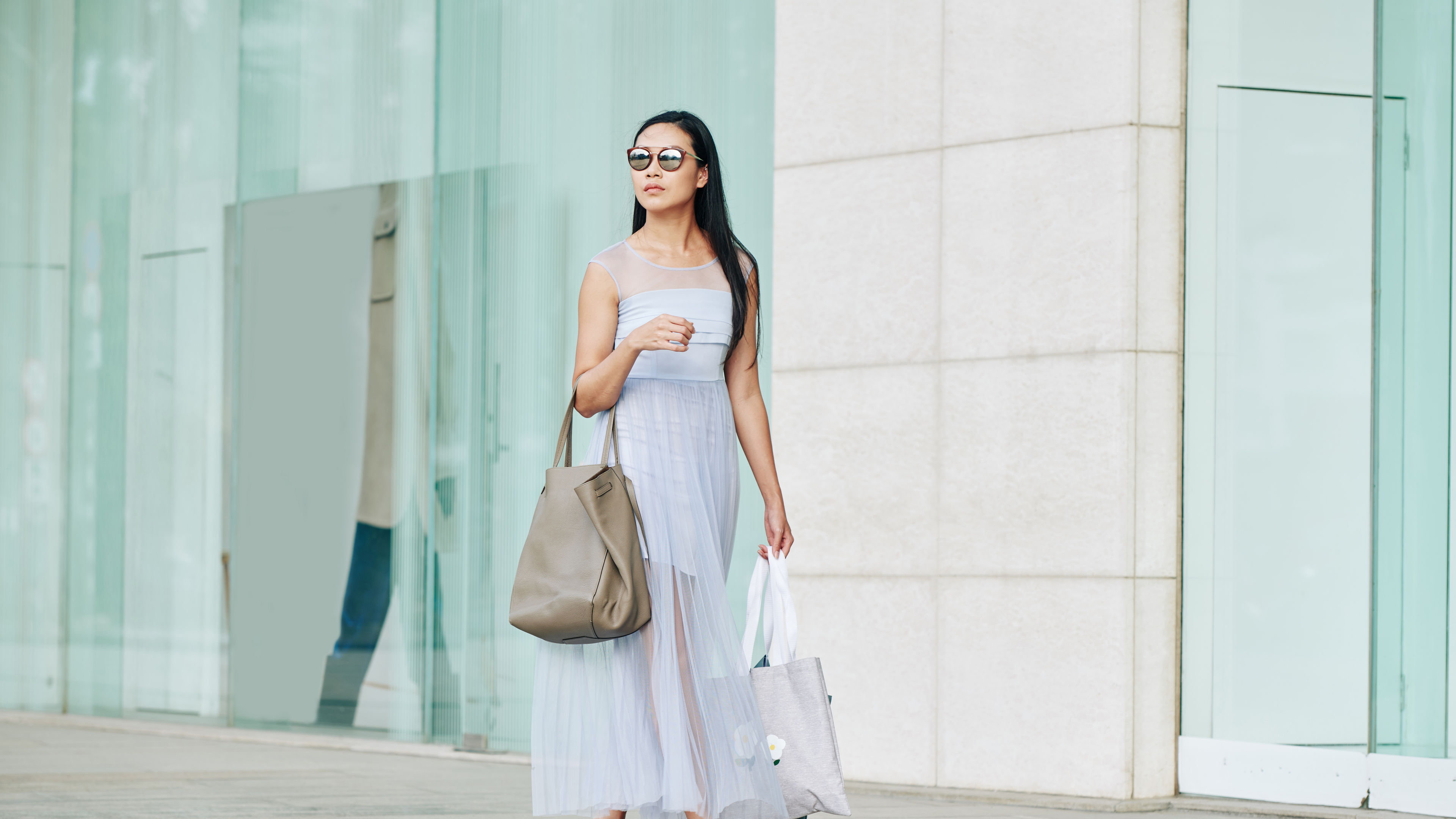 A woman wearing white midi dress