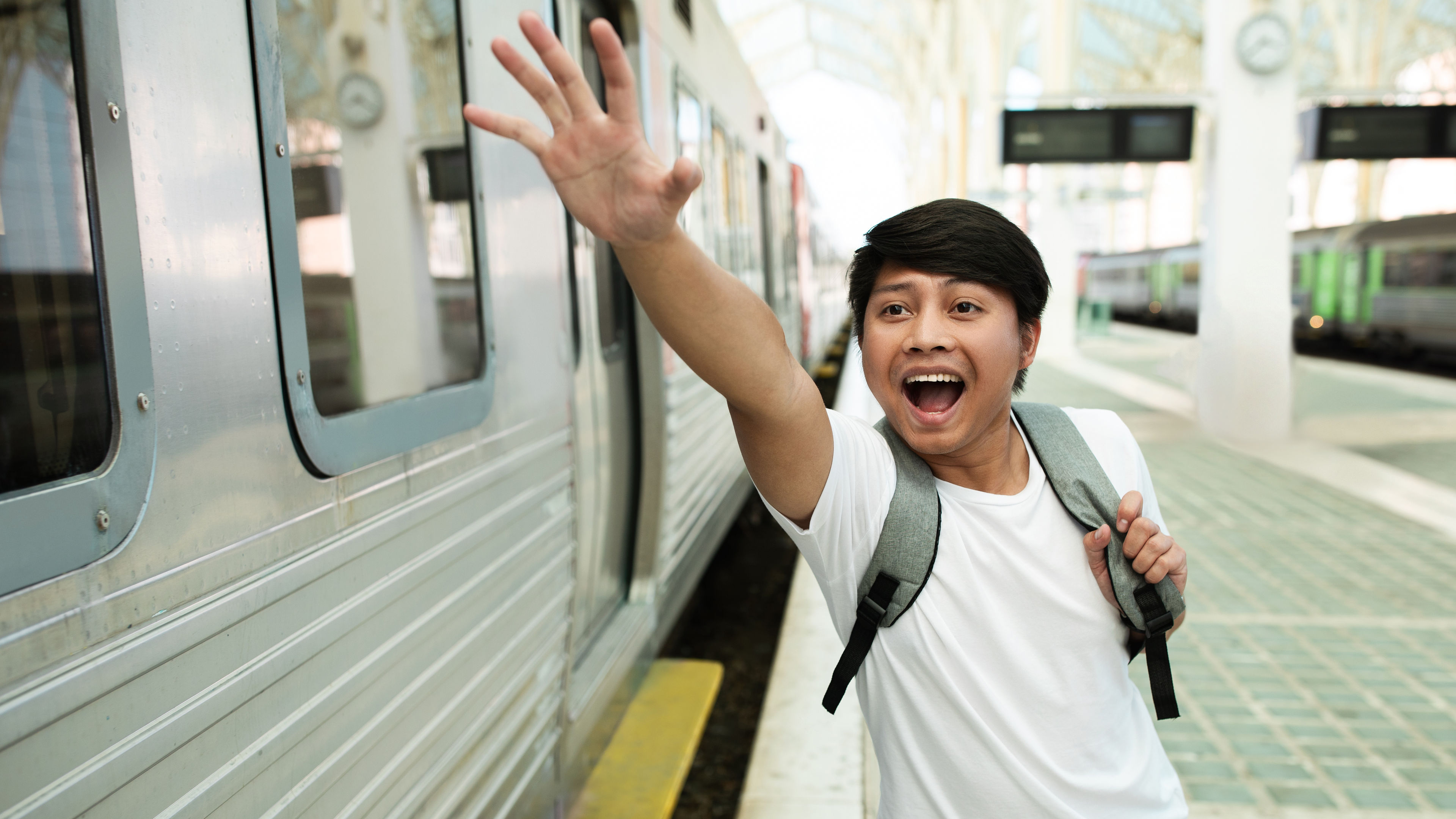A young traveller running to get the train