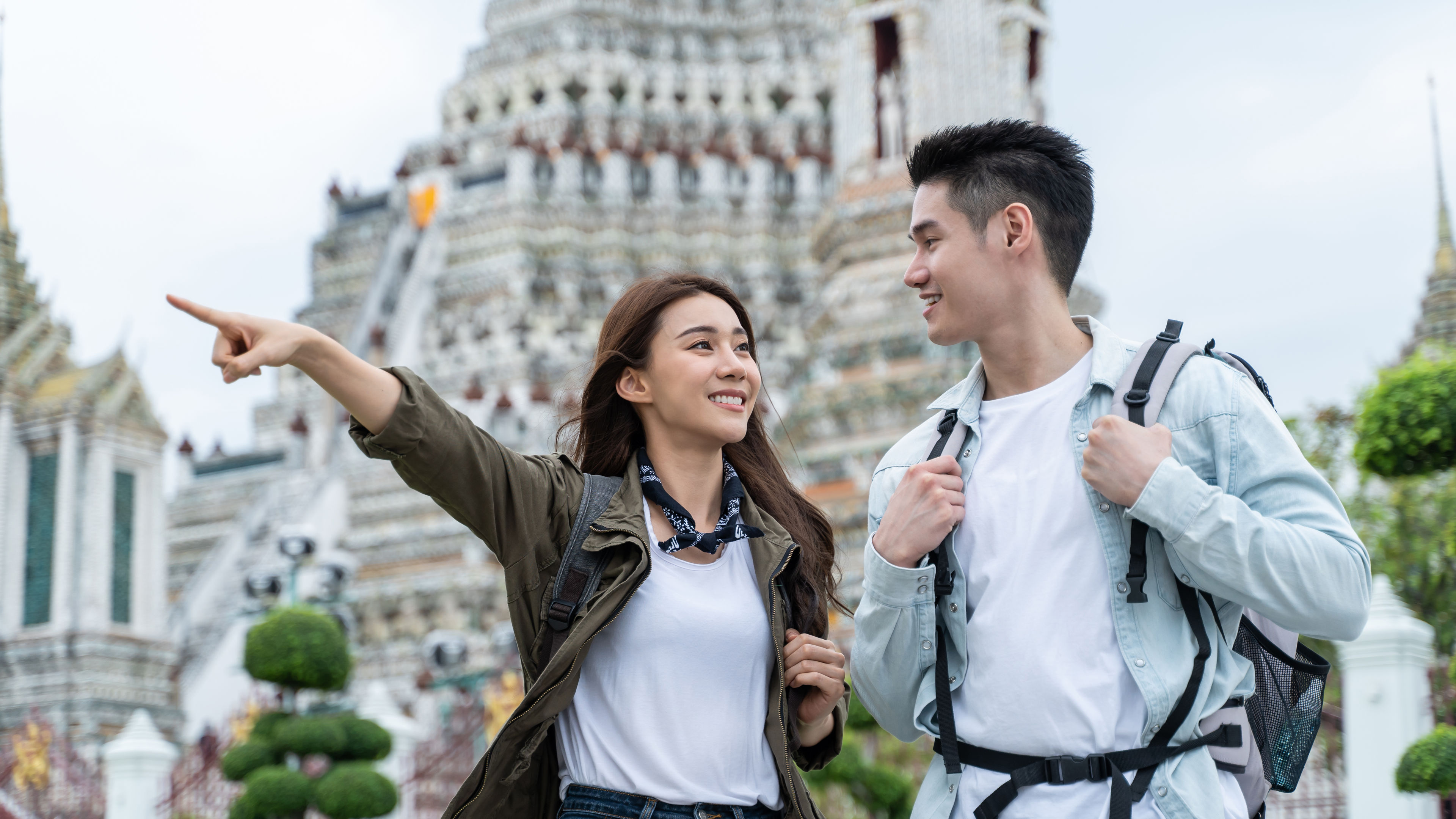 Asian attractive romantic couple travel in the city for honeymoon trip. 