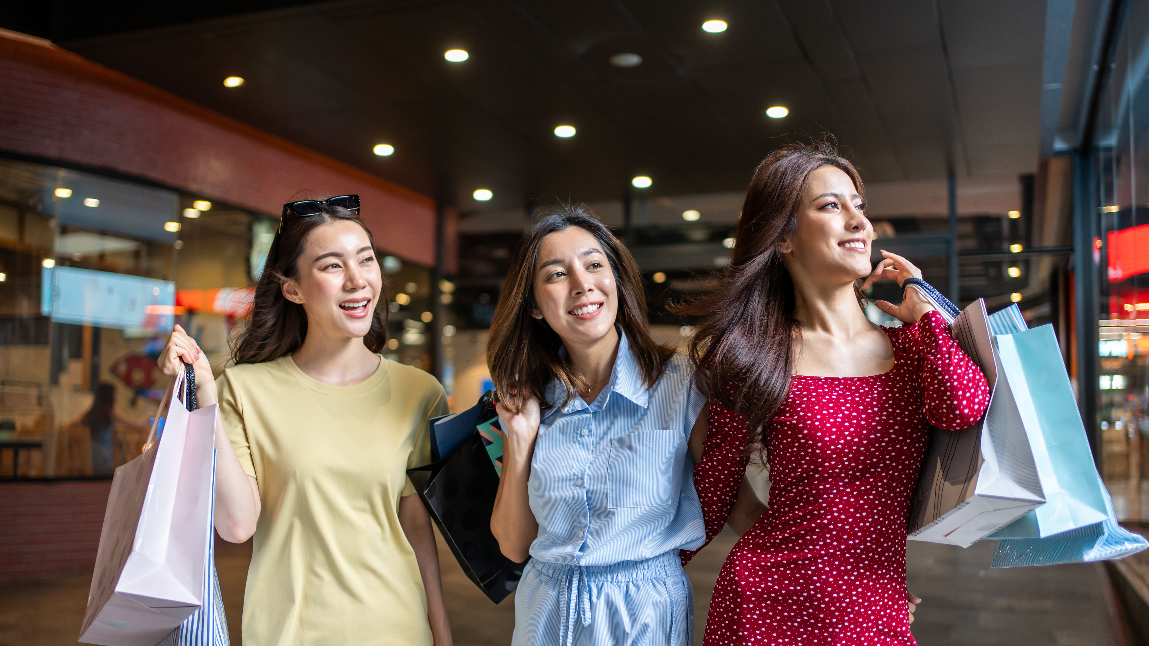 Asian beautiful three women shopping goods indoors in department store