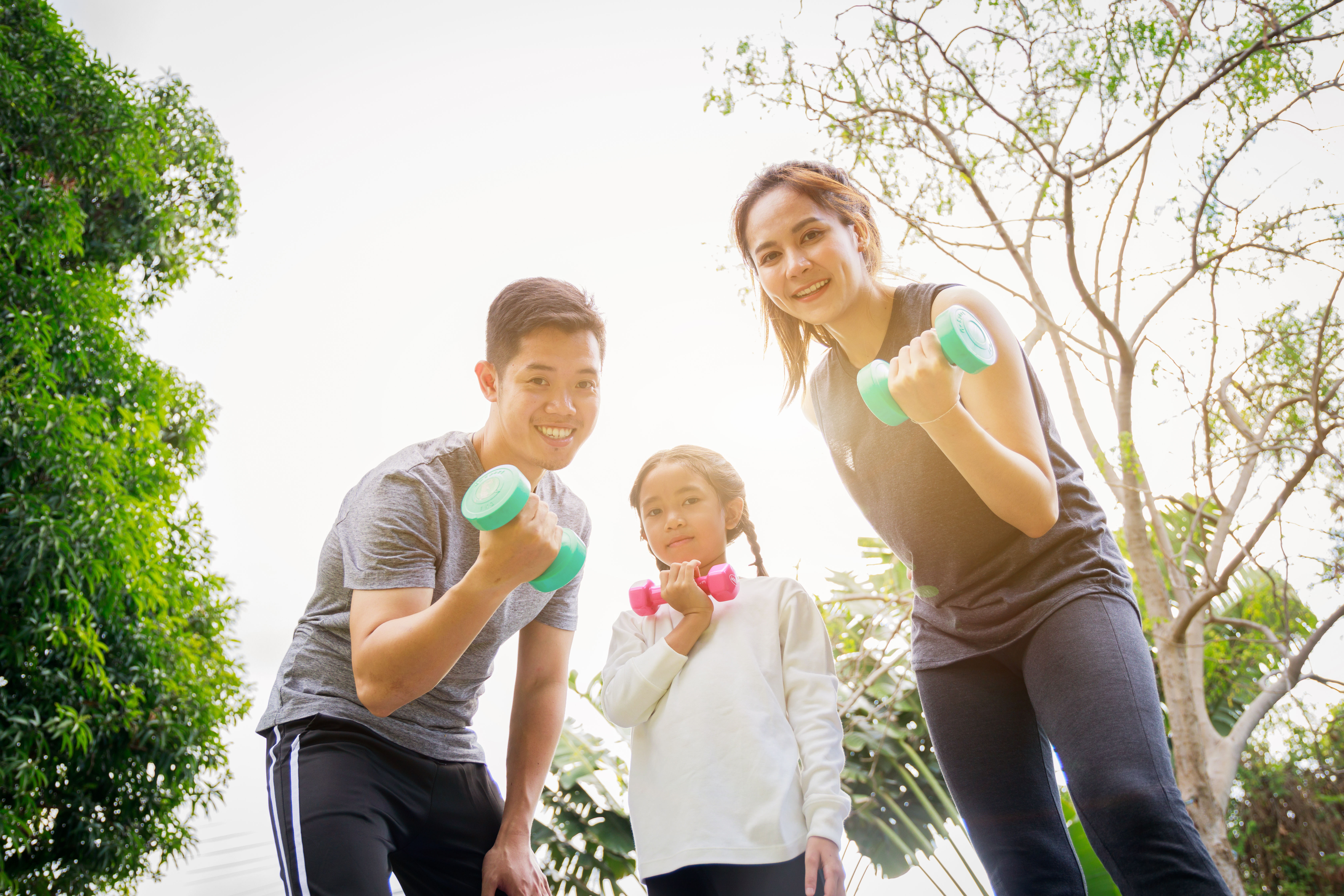 Image of asian family exercising 