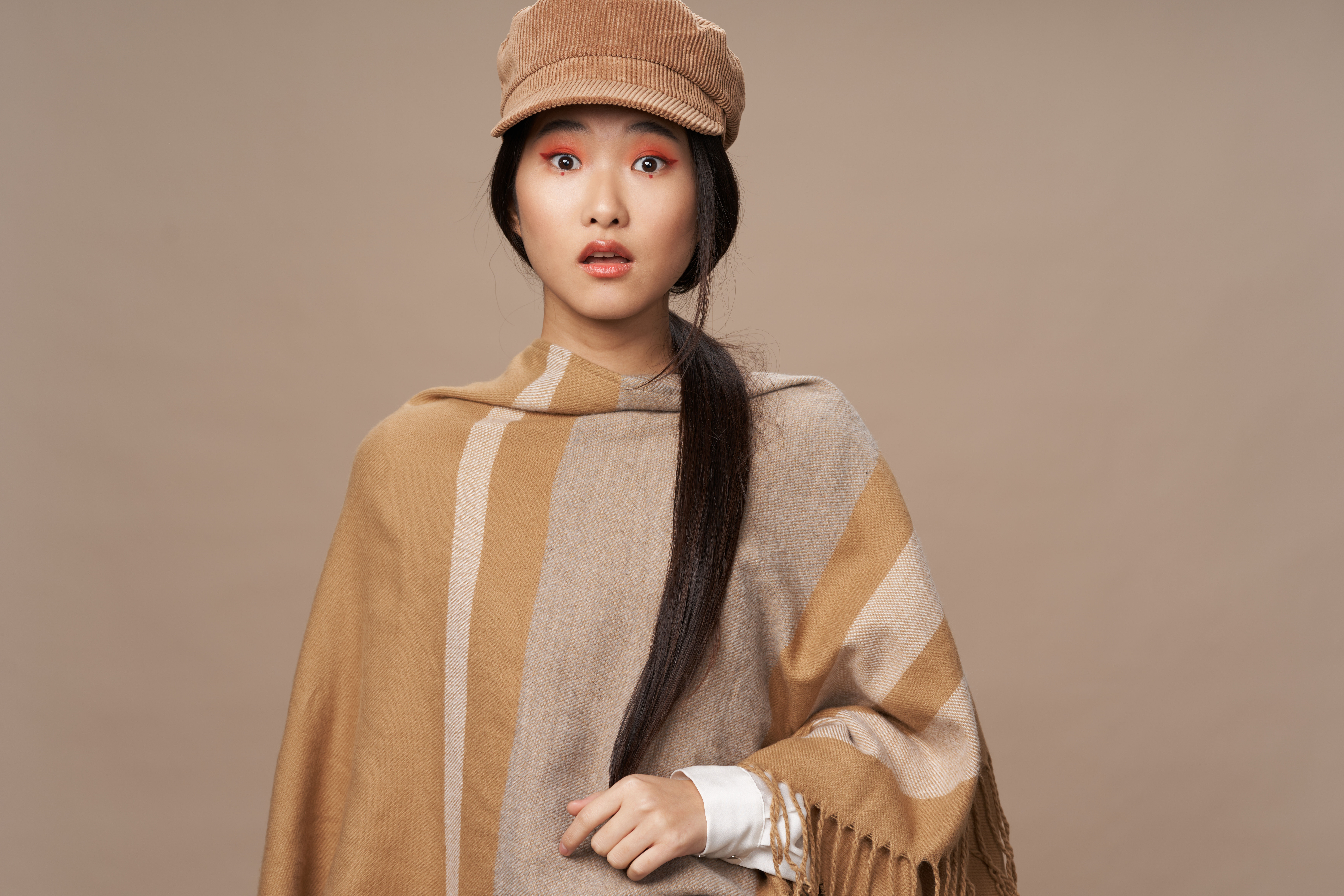 An Asian-inspired look with vibrant makeup and graceful style