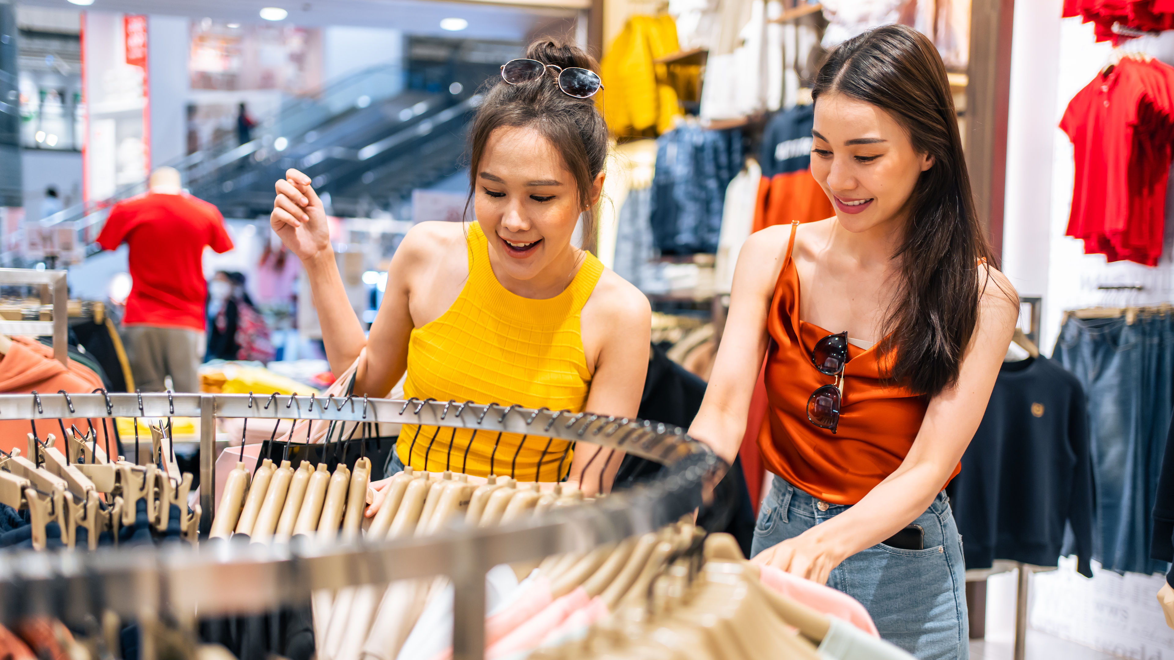 Asian two beautiful women looking at clothes
