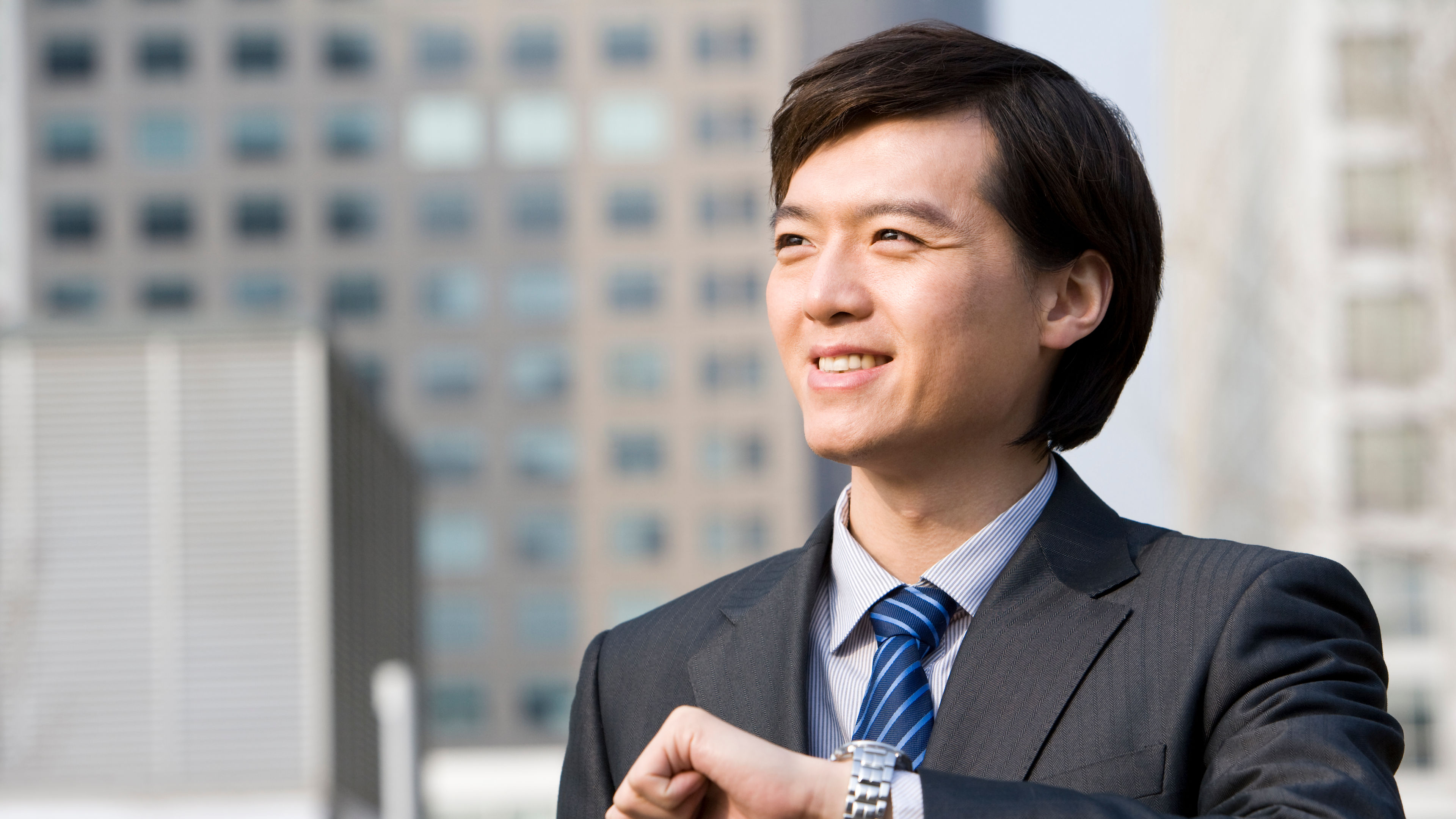 Businessman checking wristwatch
