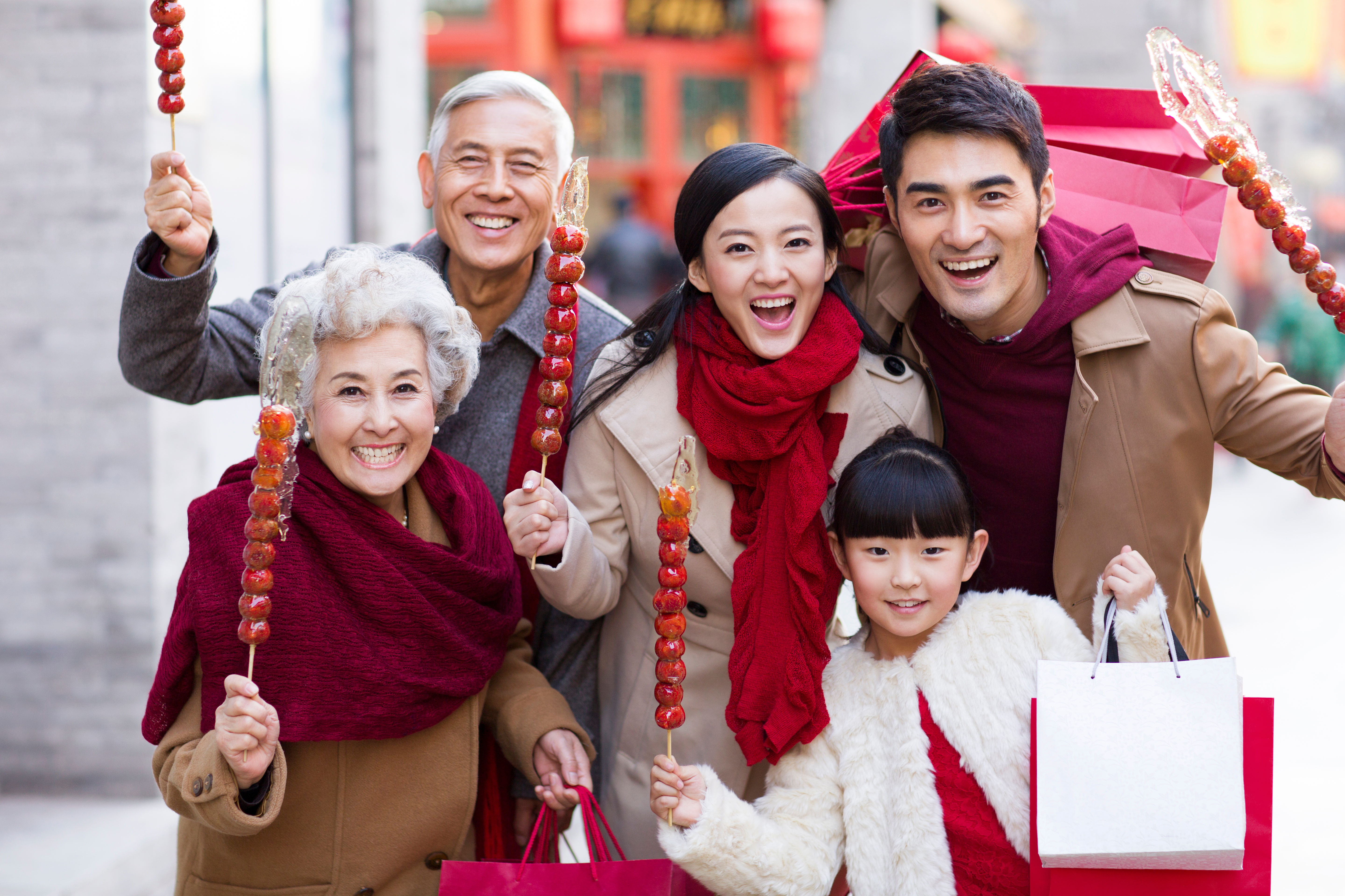 Family with candied berries celebrating 