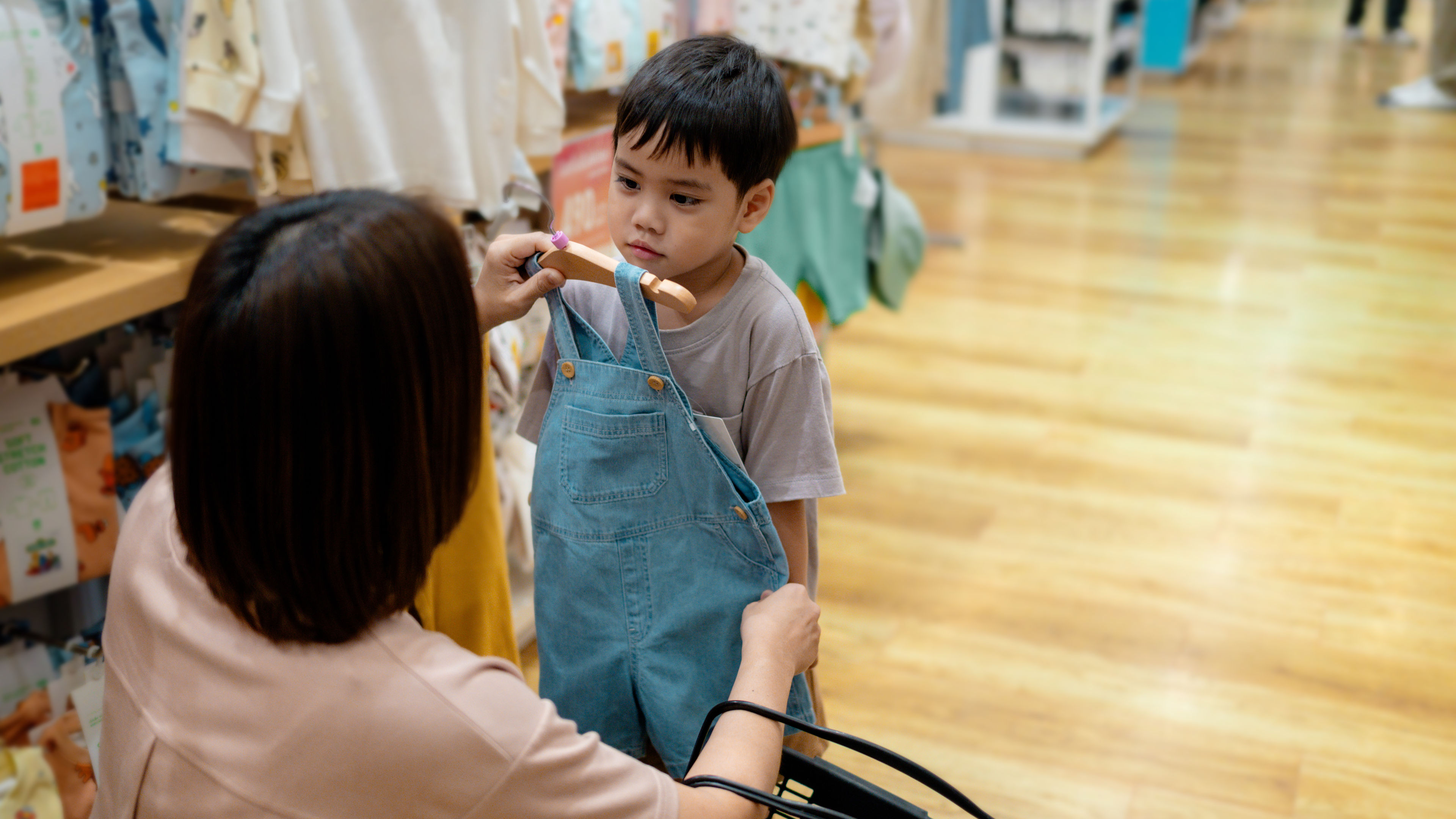 Child trying clothes at shop