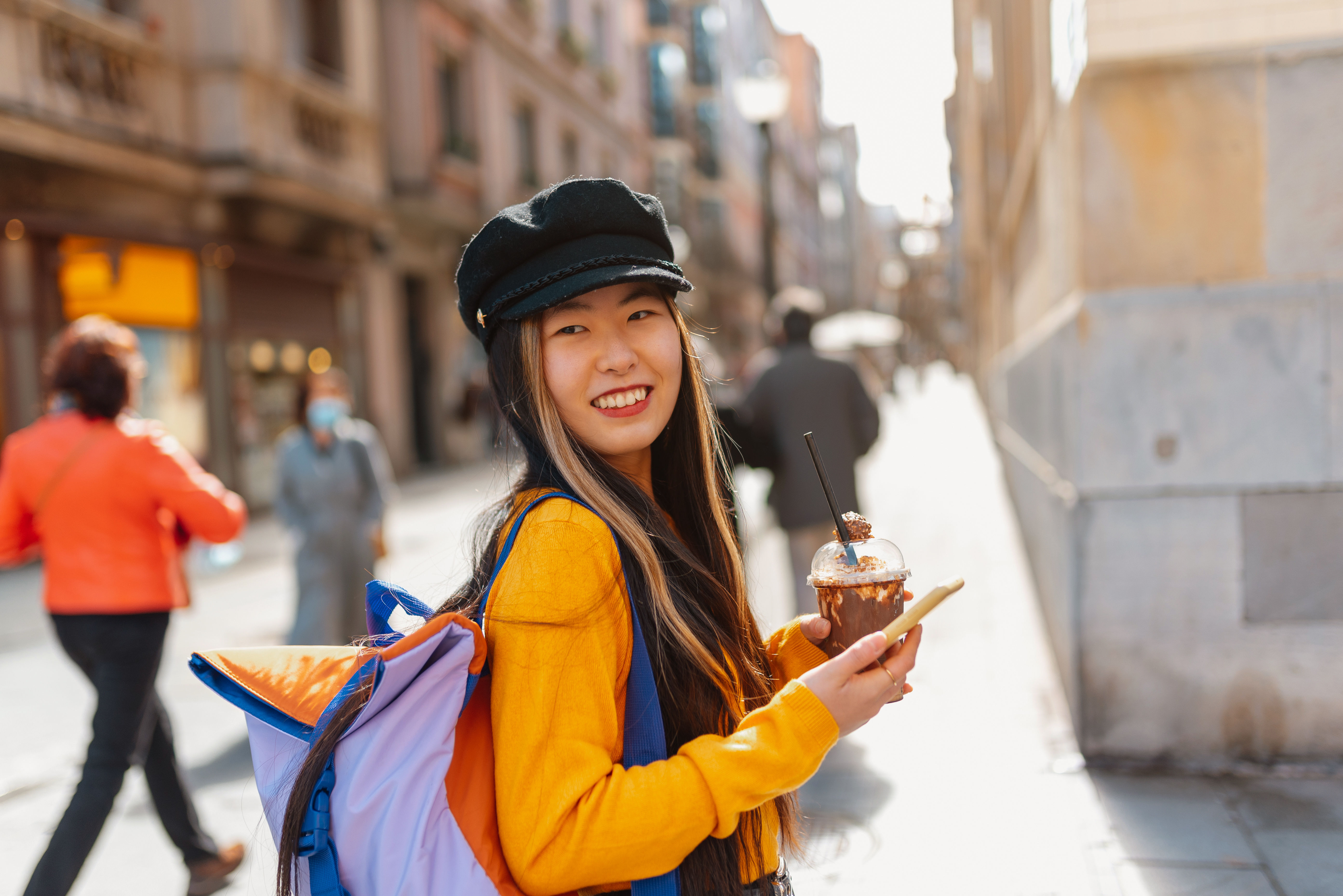 A Chinese tourist enjoying the sights and attractions while exploring Europe. 