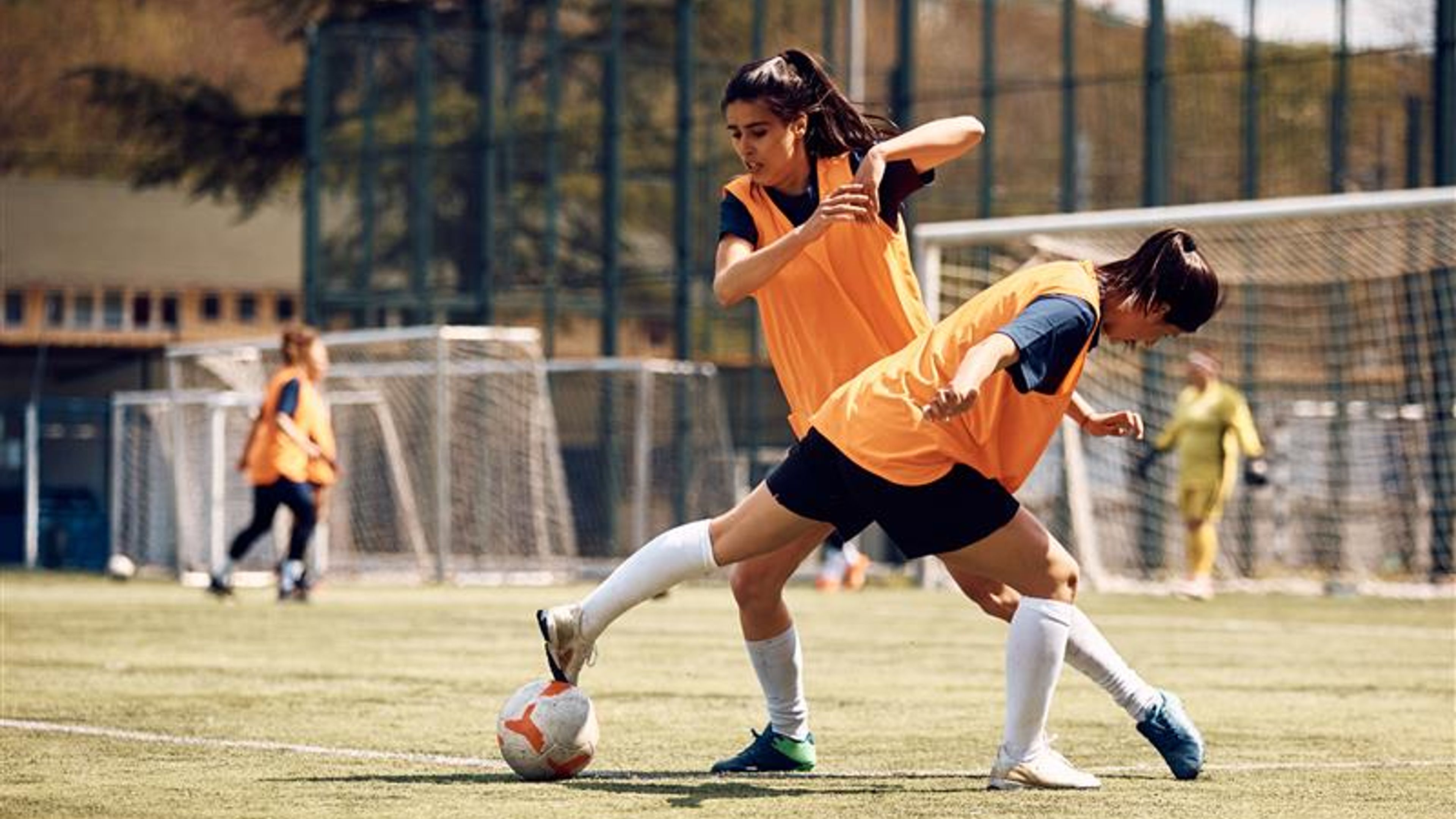 Female players in action on the soccer pitch