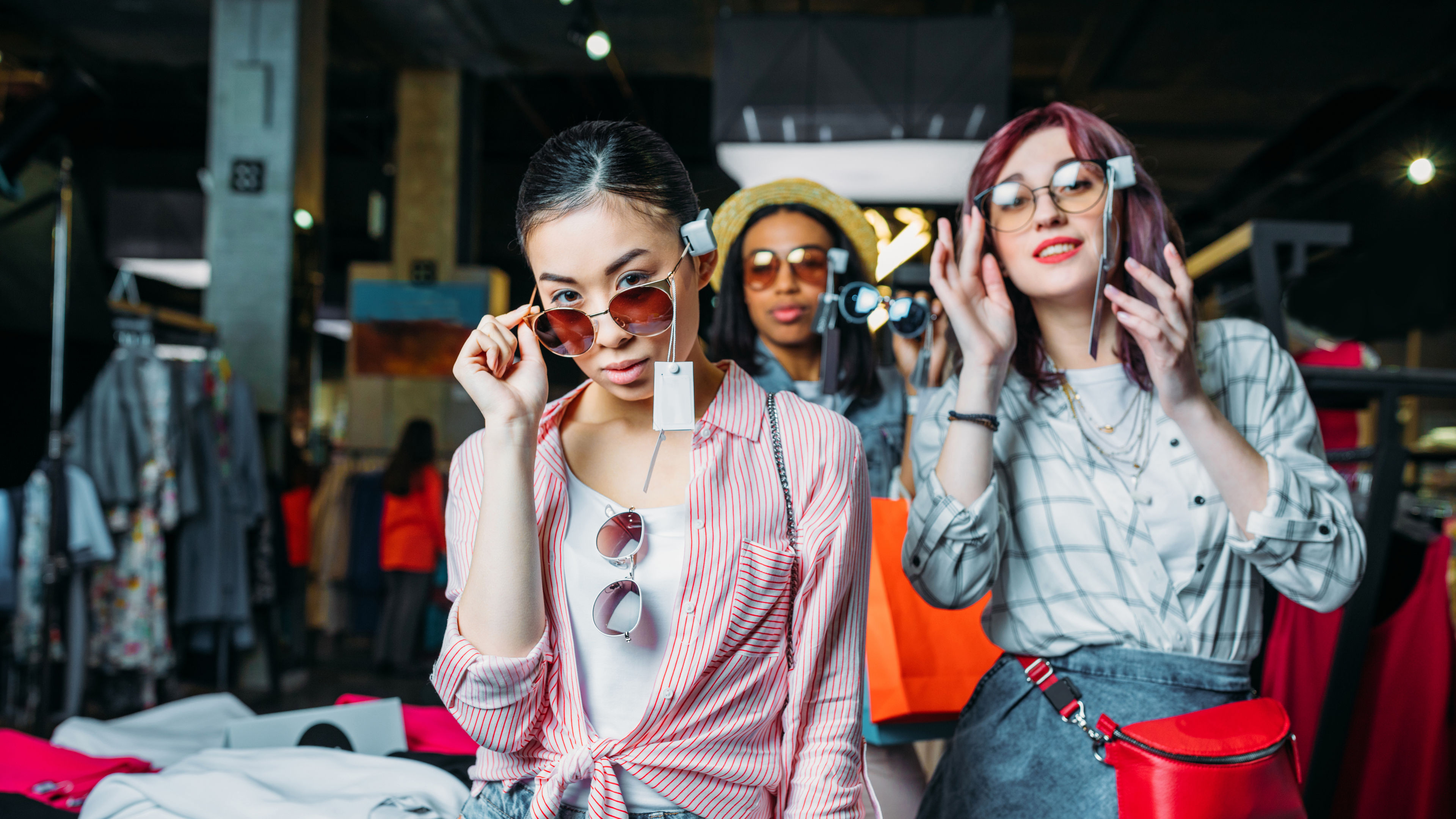 girls choosing clothes in boutique, fashion shopping girls concept