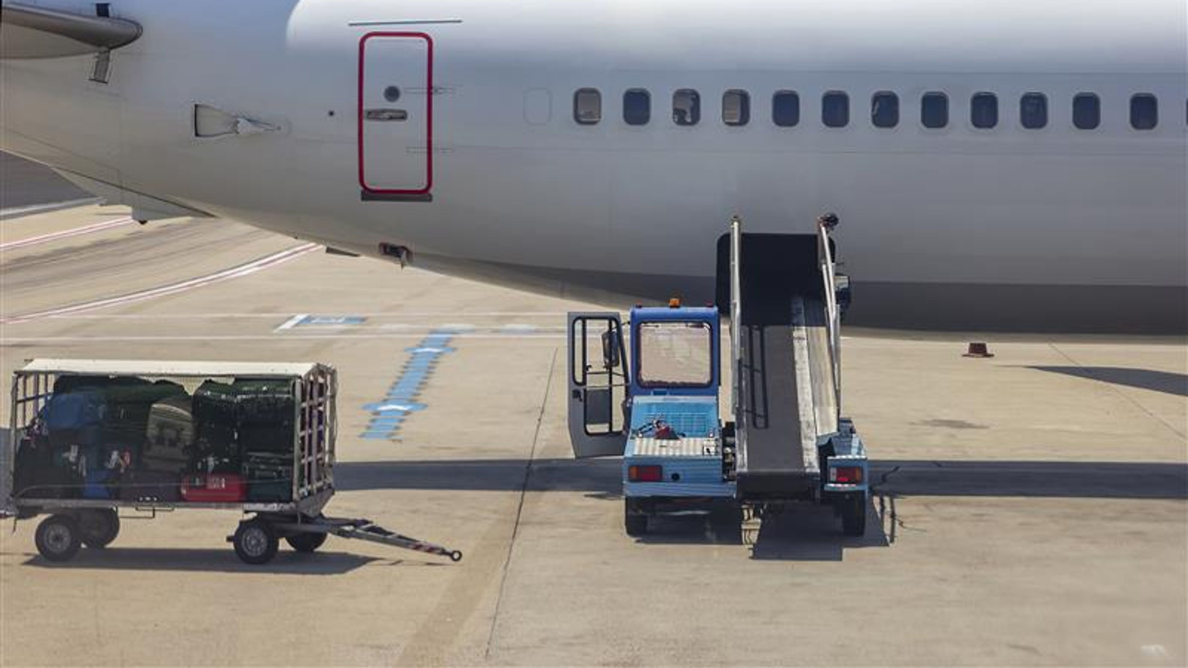 Loading - unloading bags, luggage, and to/from an airplane in the airport
