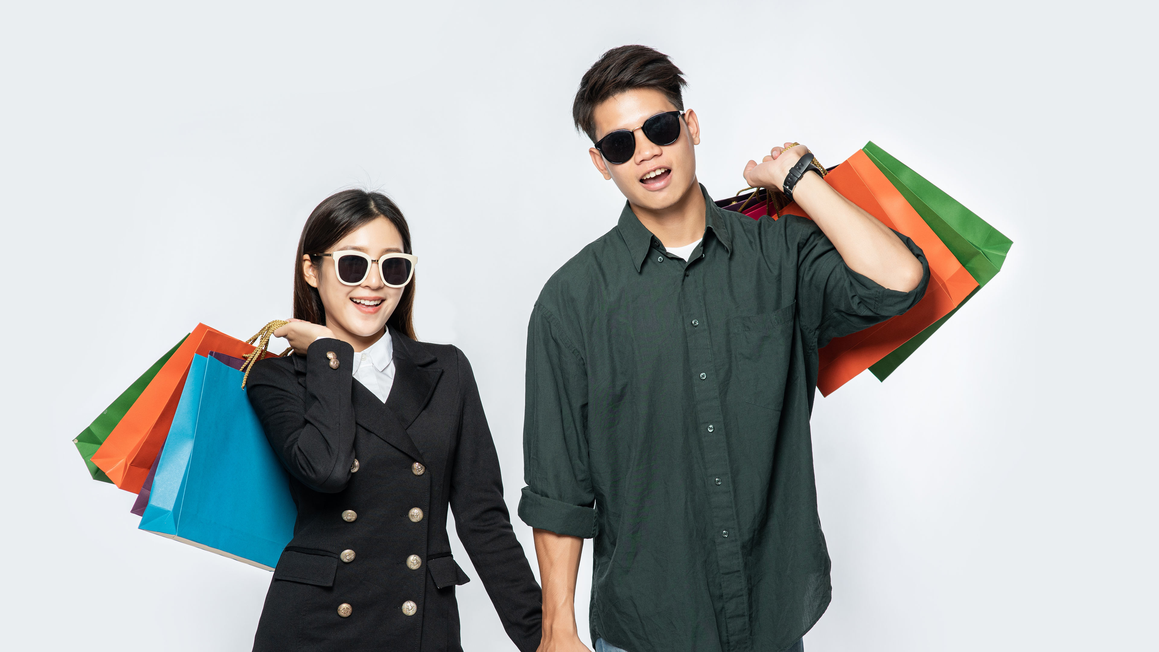 Man and Woman carrying shopping bags