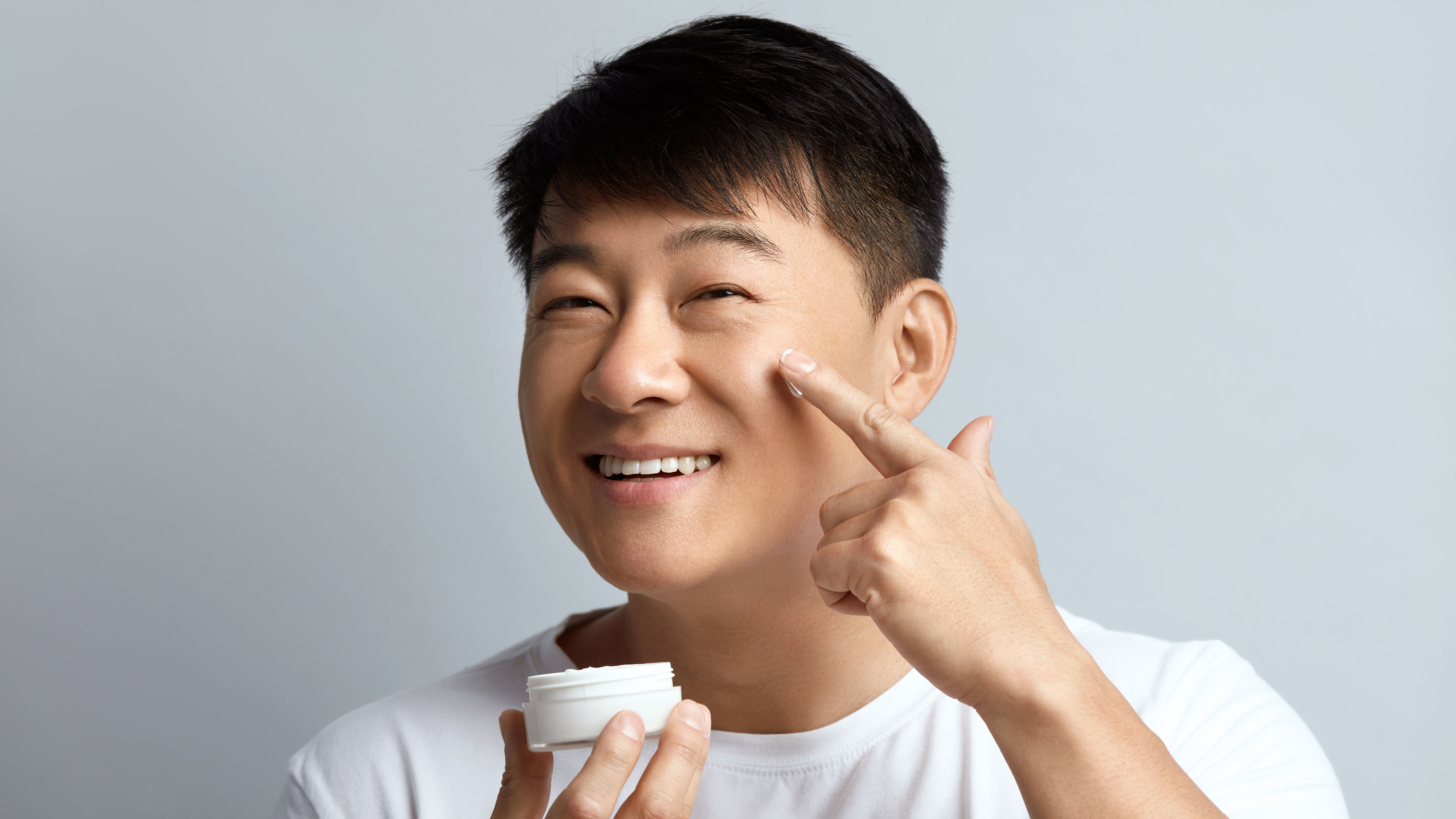 Man applying cream