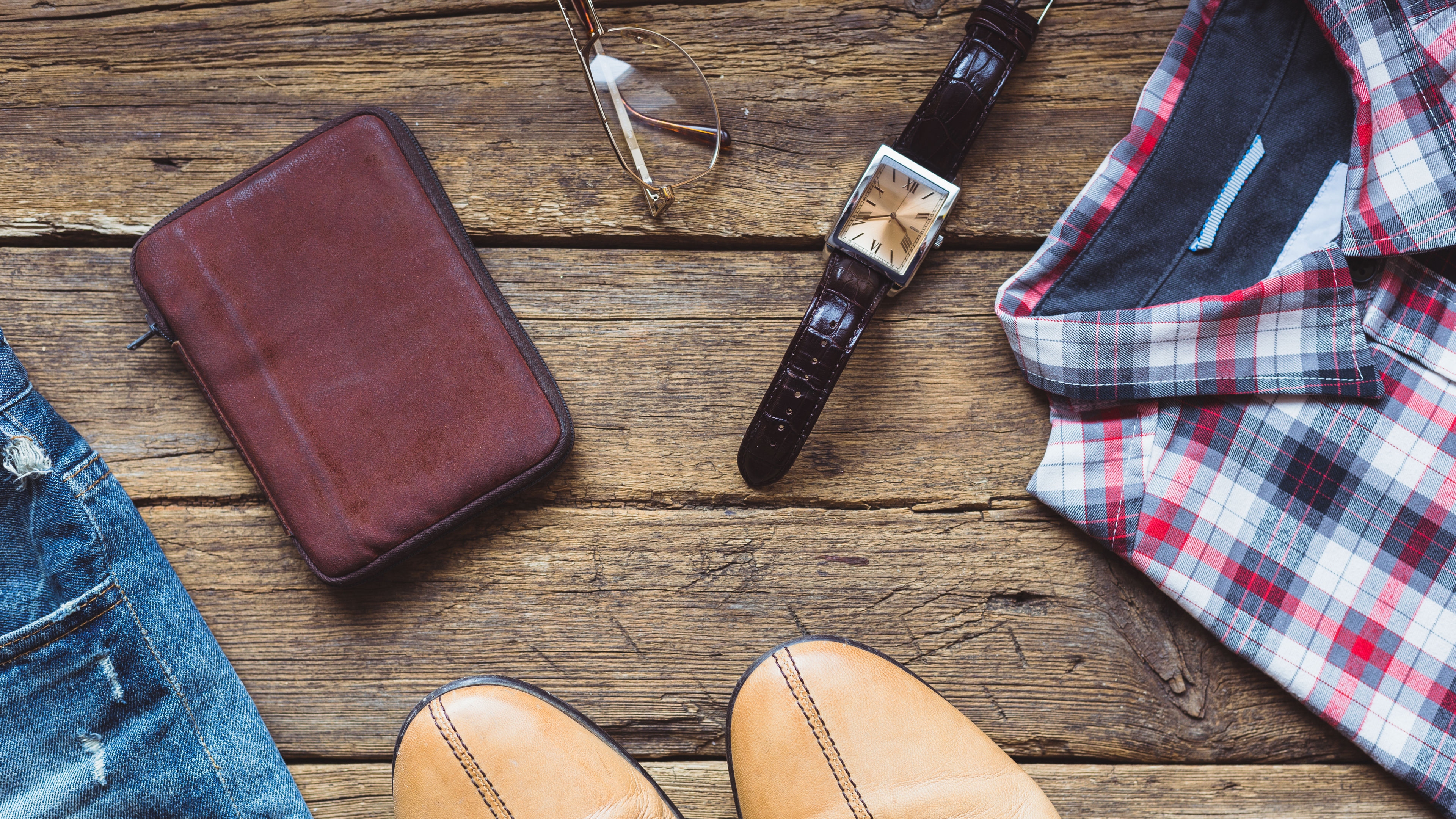 Men's clothes and accessories on wooden background