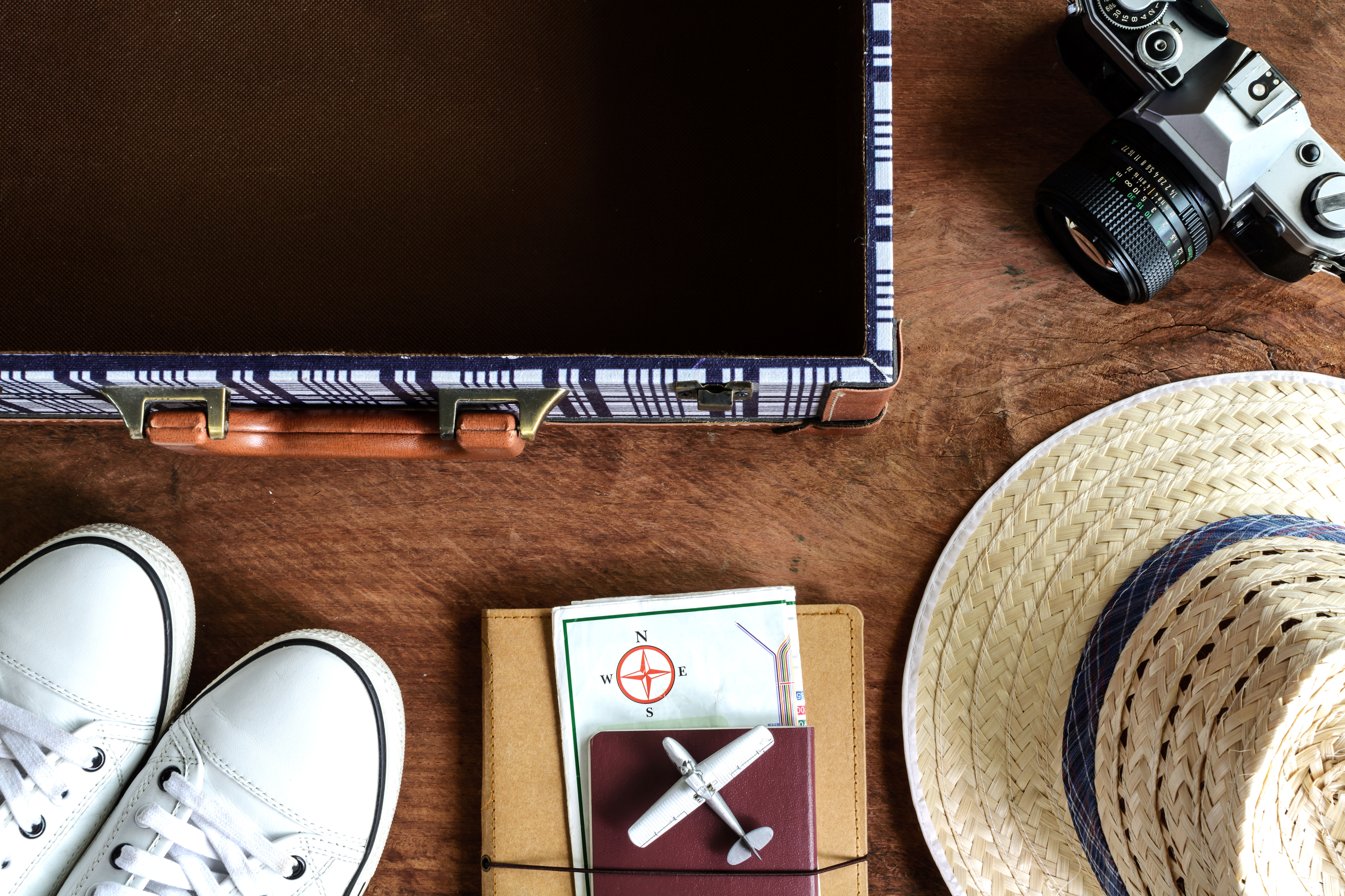  Image of a suitcase and travel essentials 
