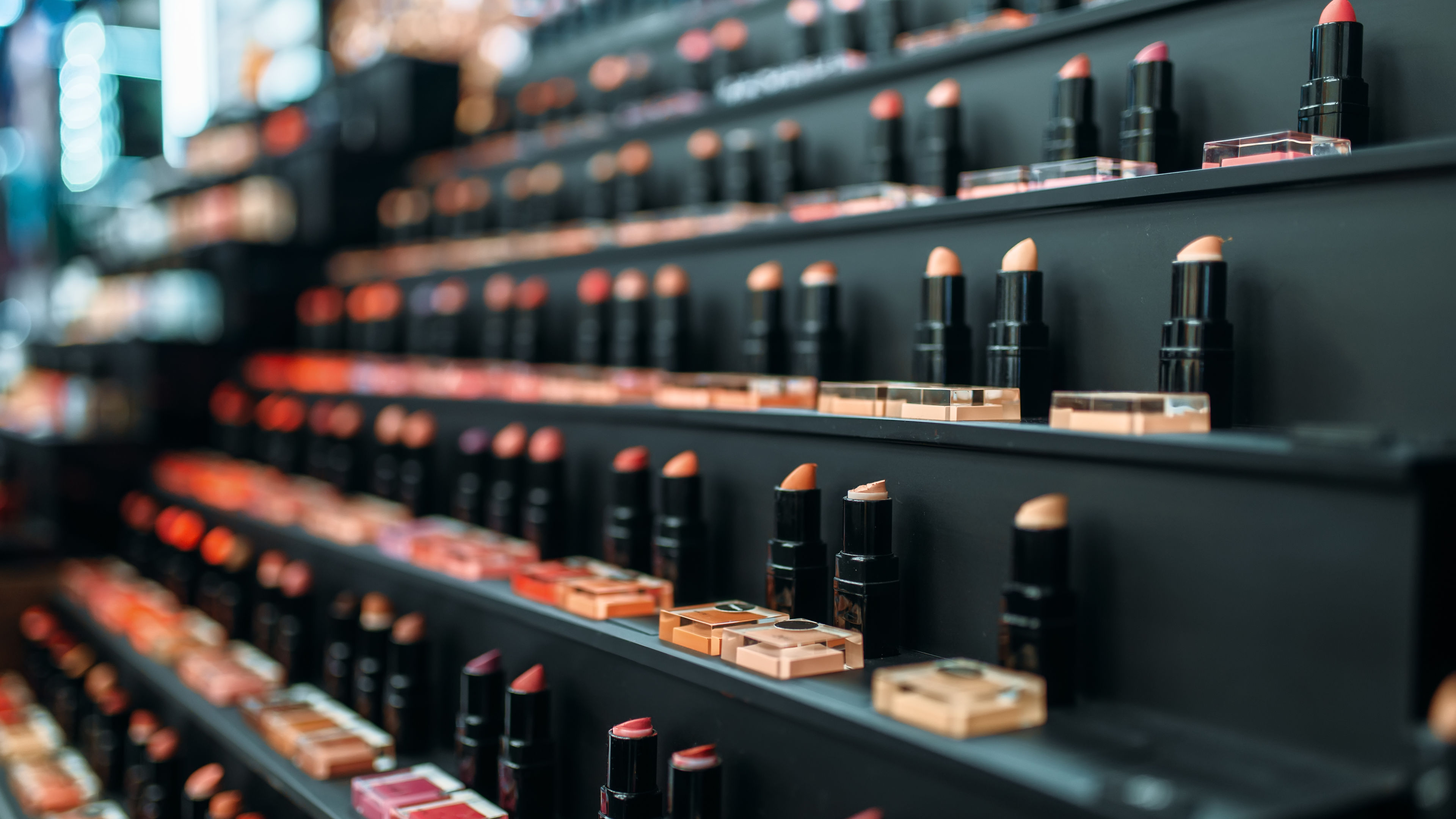 A stunning collection of vibrant lipsticks arranged neatly 