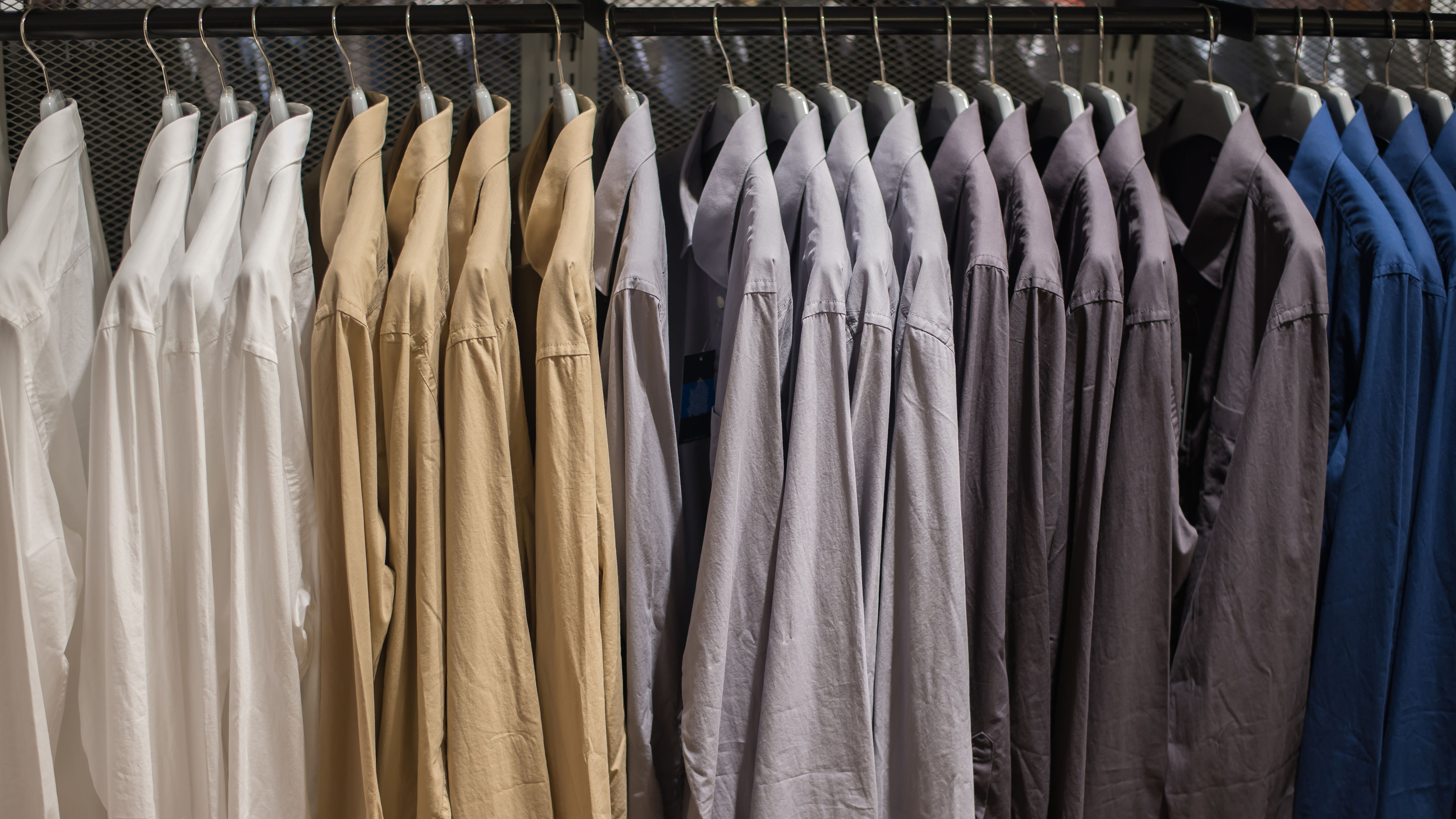 Shirt hanging on rail at Clothes shop