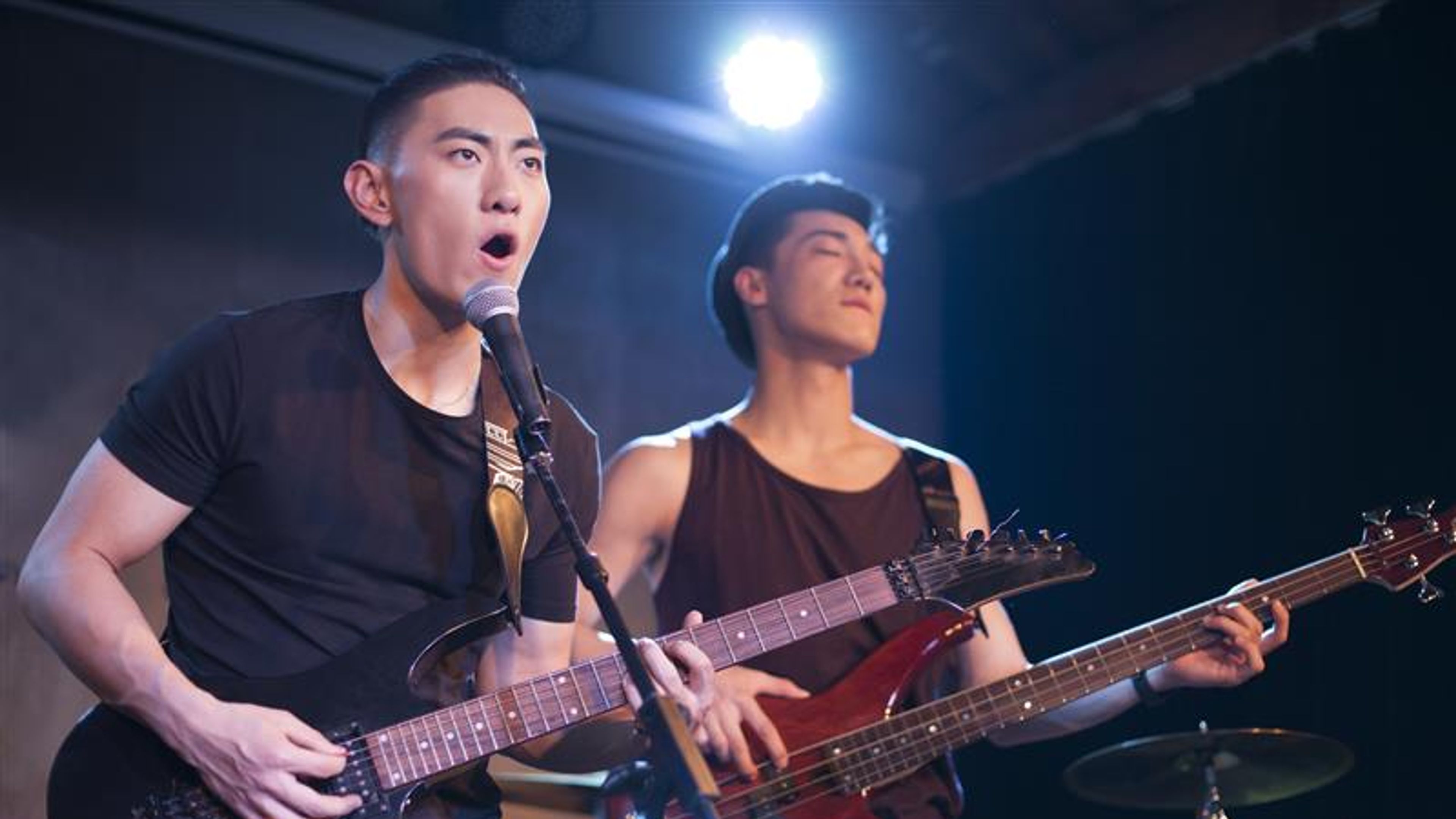 The musical band performing on stage