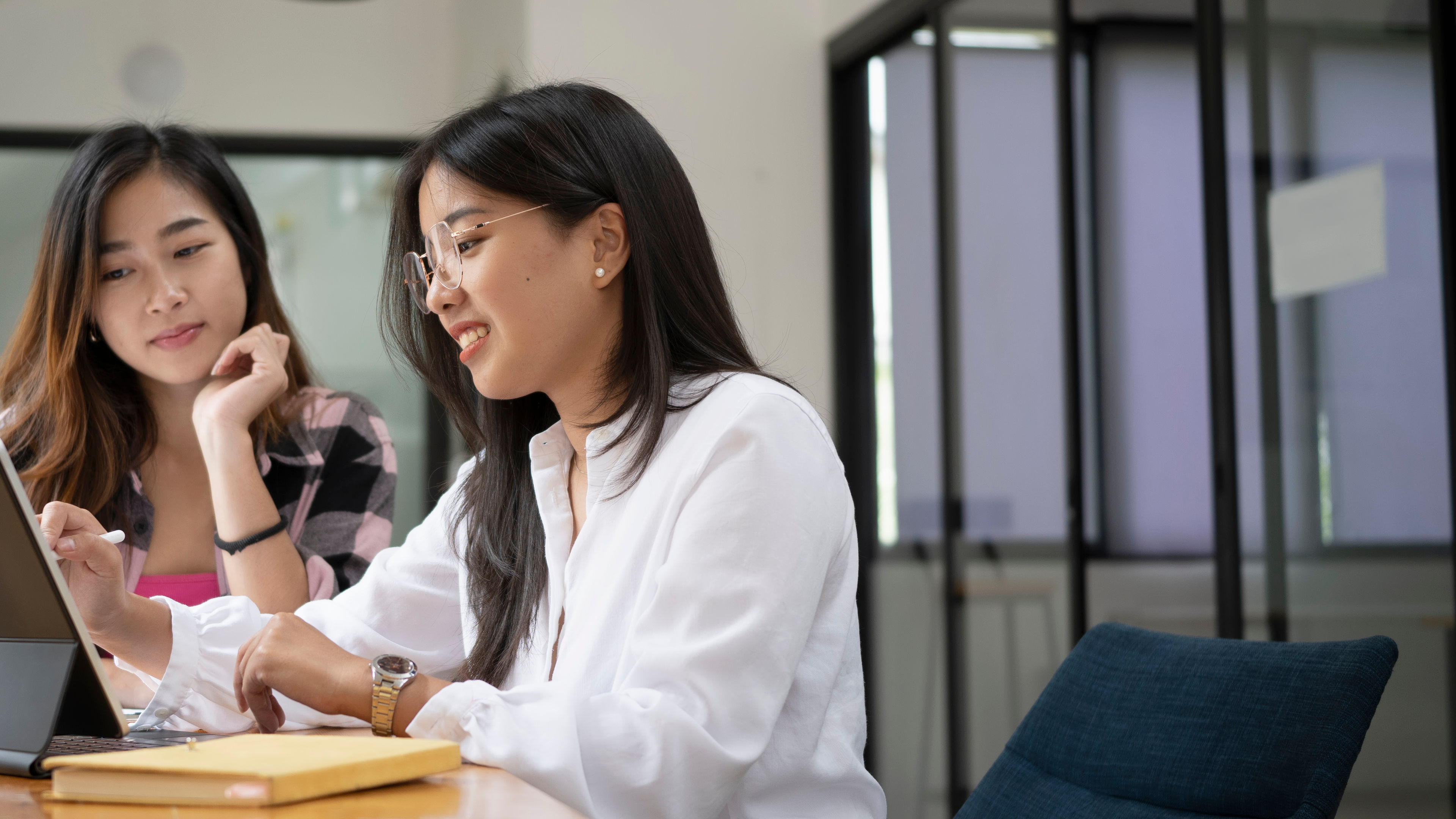 Two students using laptops