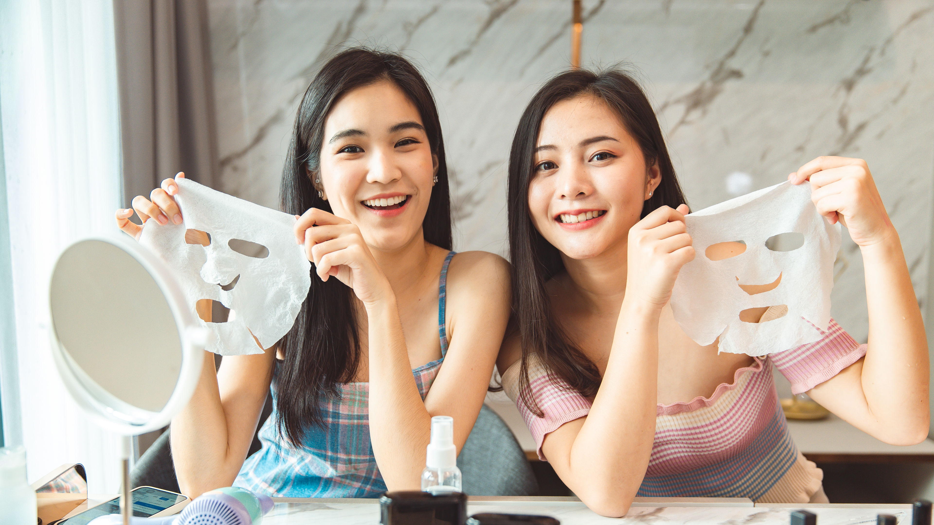Two Young Women Doing Beauty Mask 