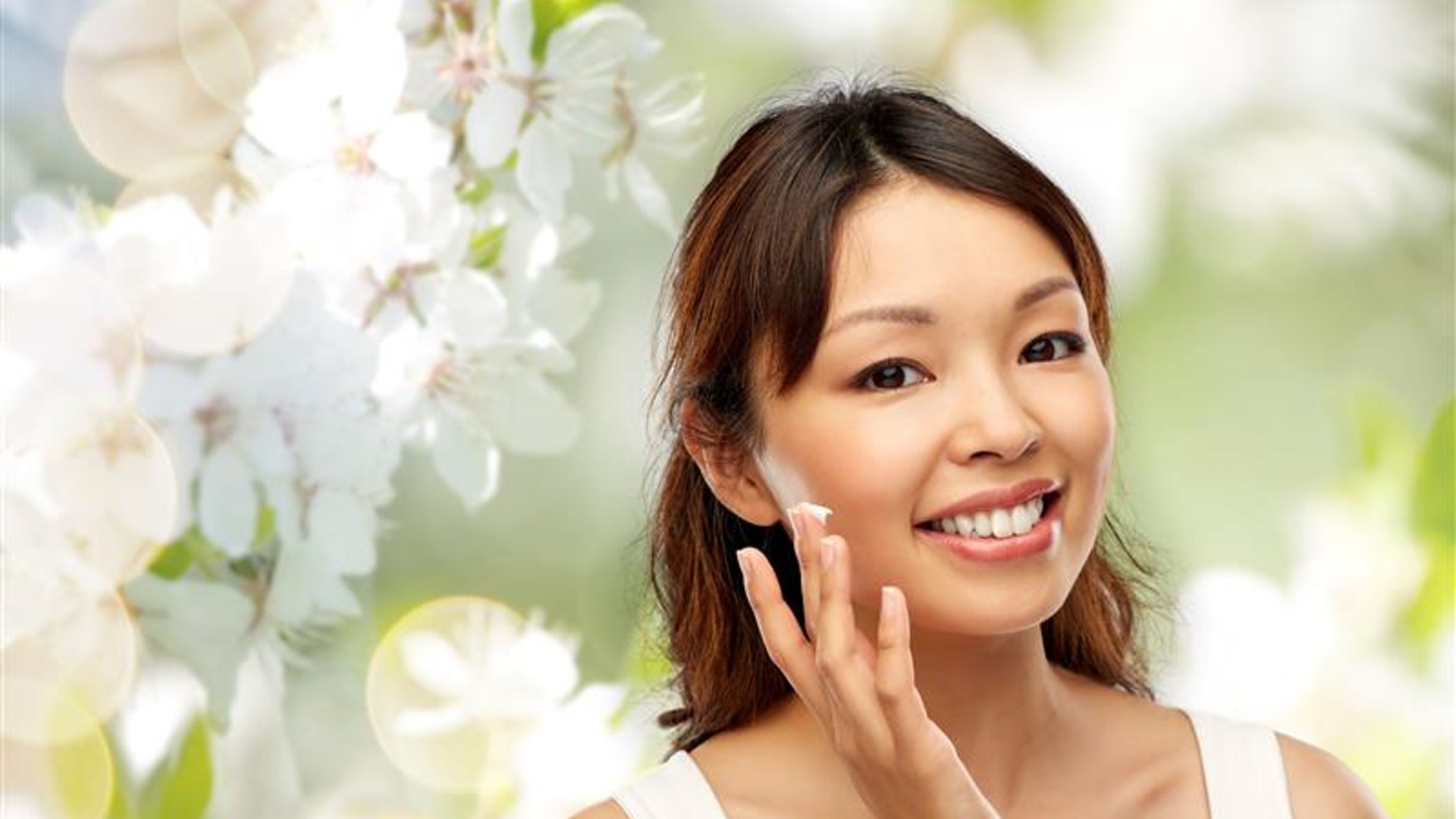 Woman applying cream 