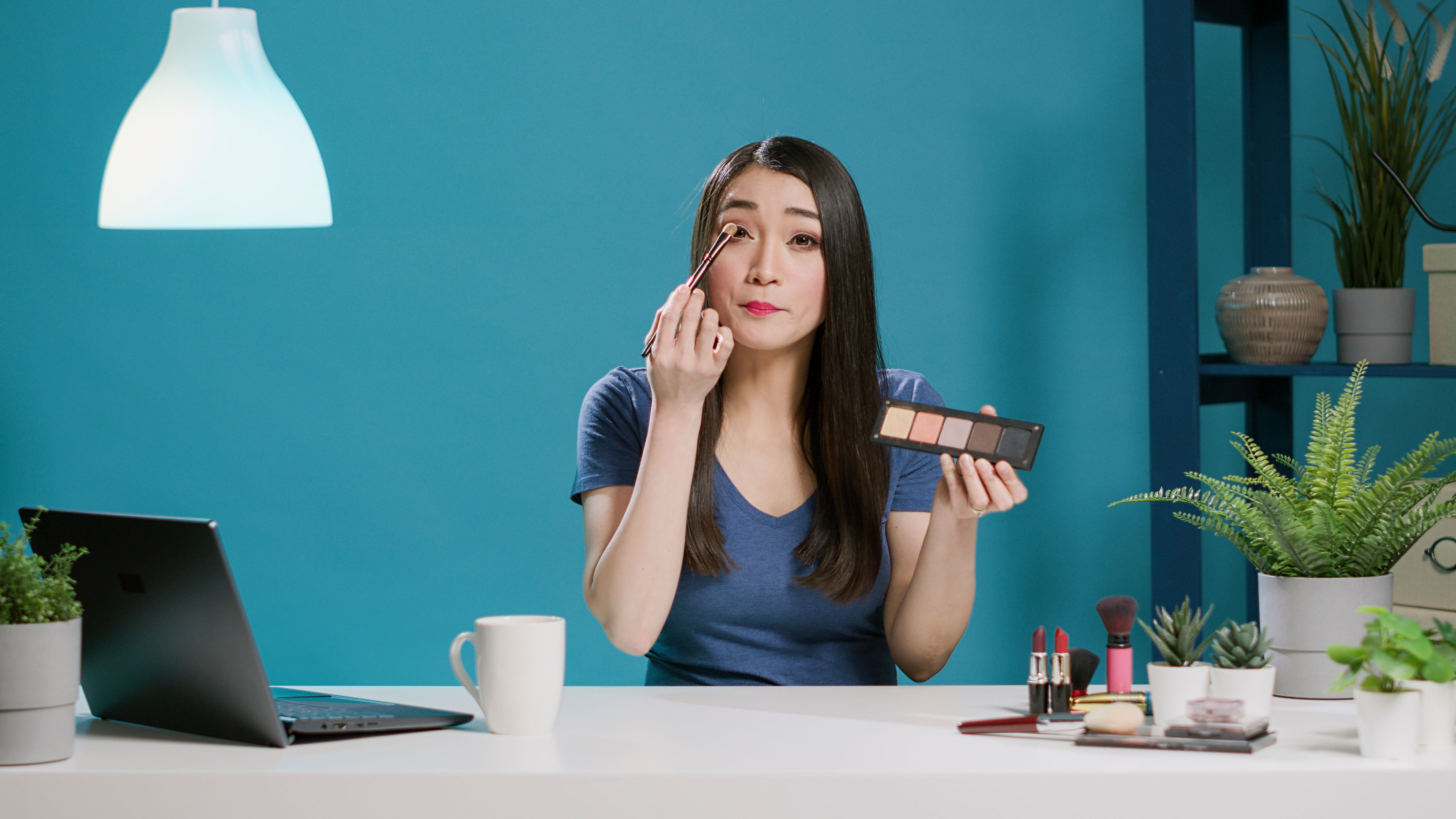 Woman applying make up 