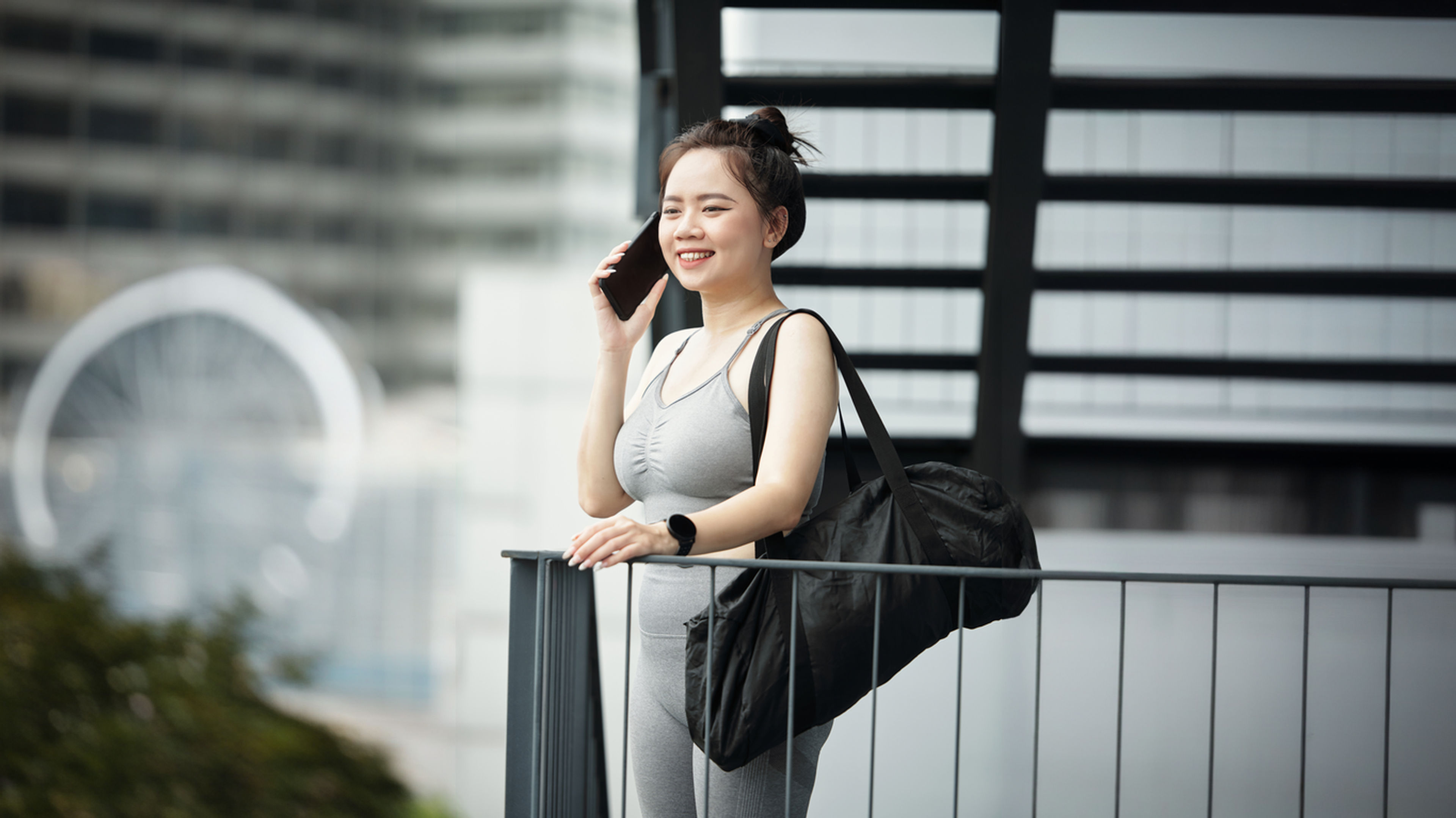 Woman with gym bag.