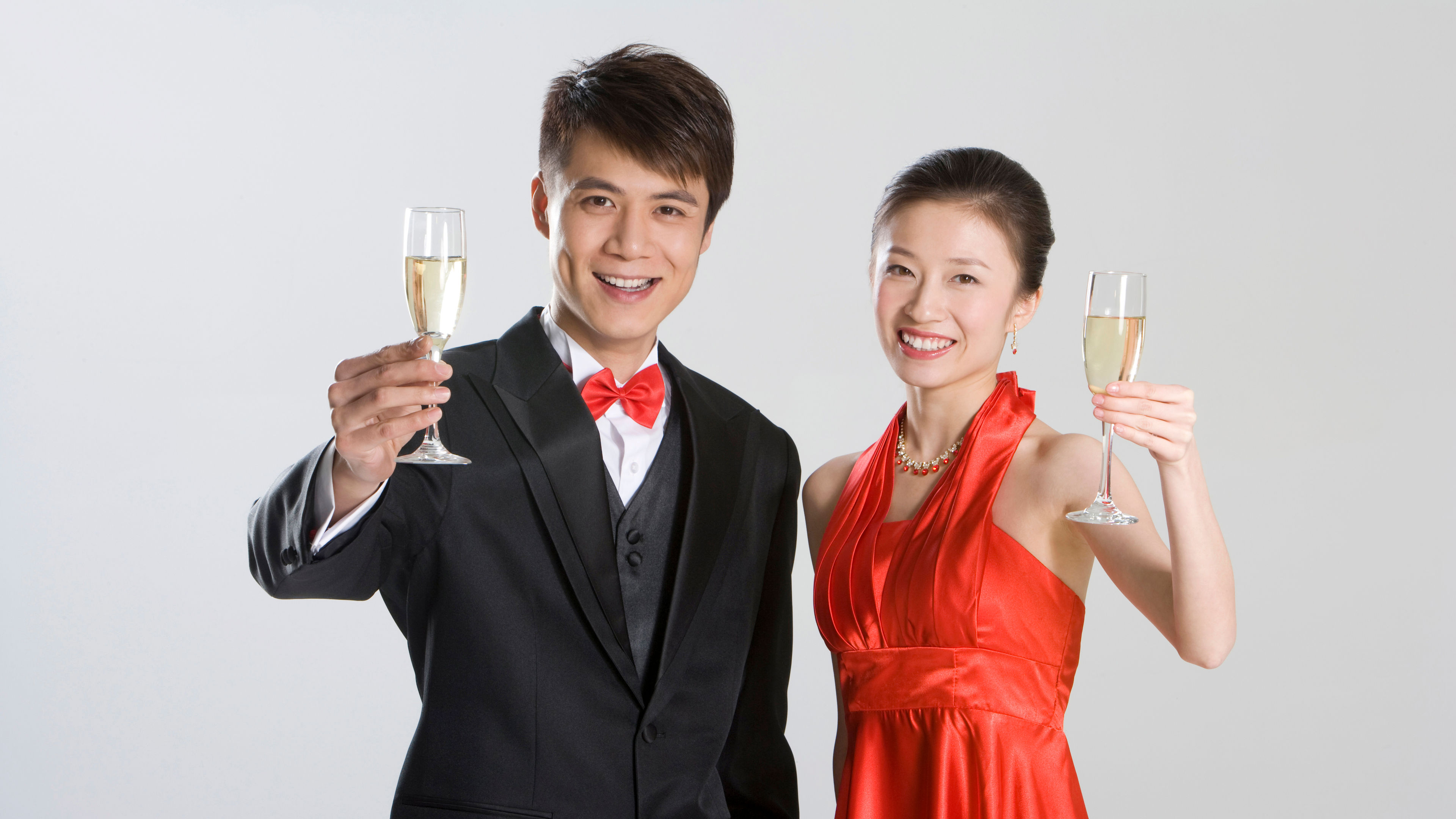Young Chinese couple toasting champagne