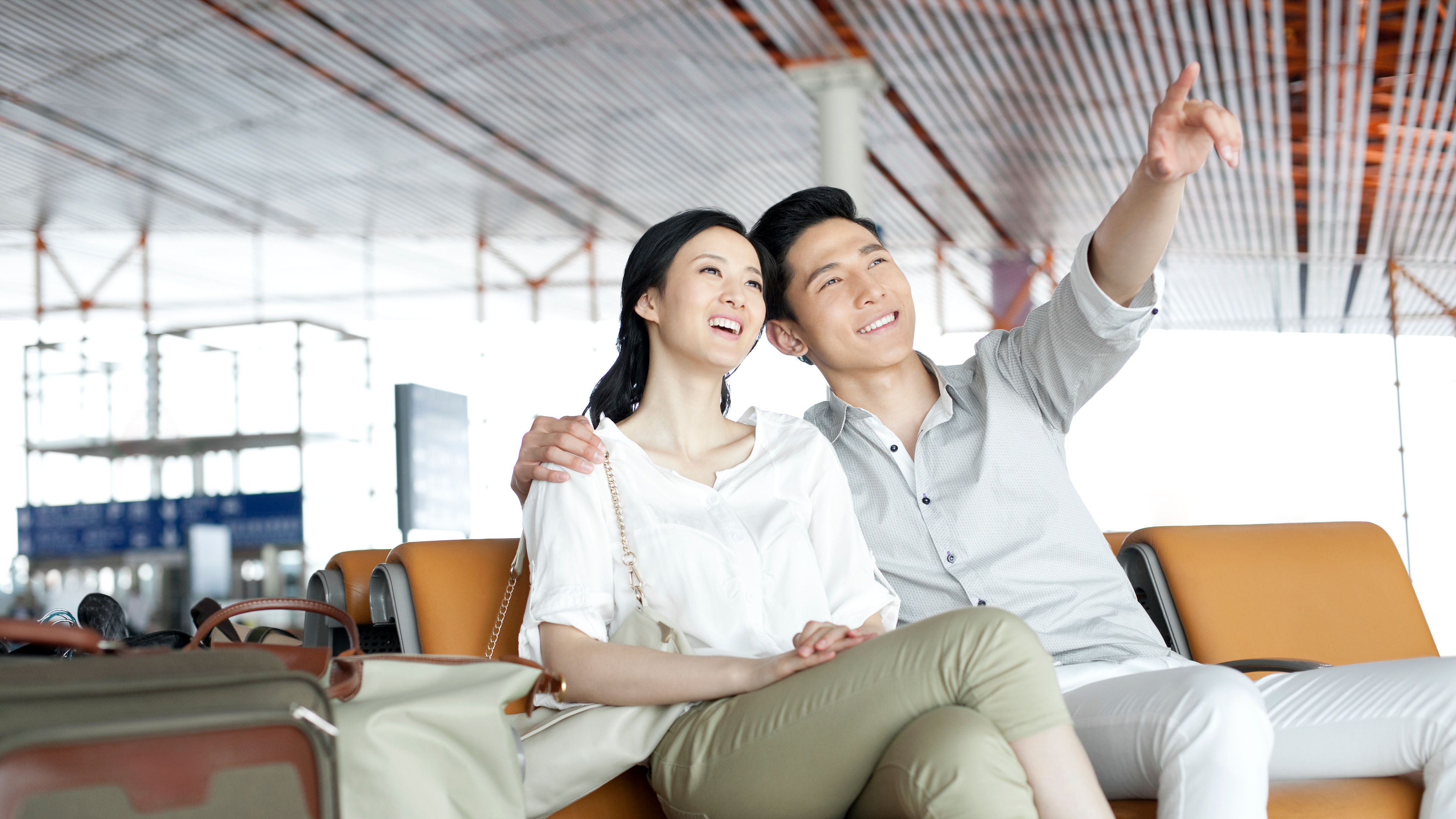 Young couple waiting in airport lounge