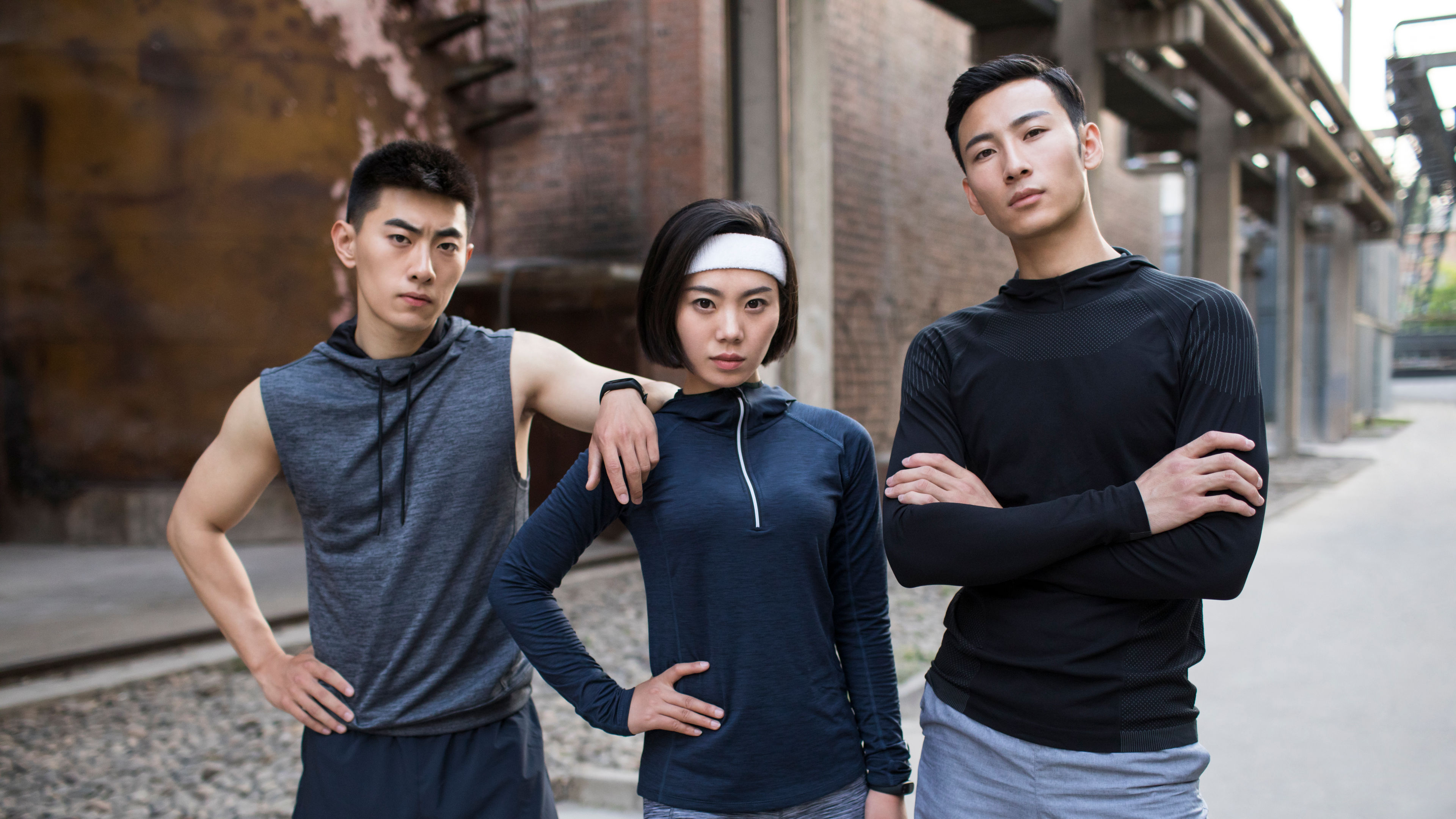 A group of young friends enjoying an outdoor workout together, staying active and embracing a healthy lifestyle while surrounded by nature. 